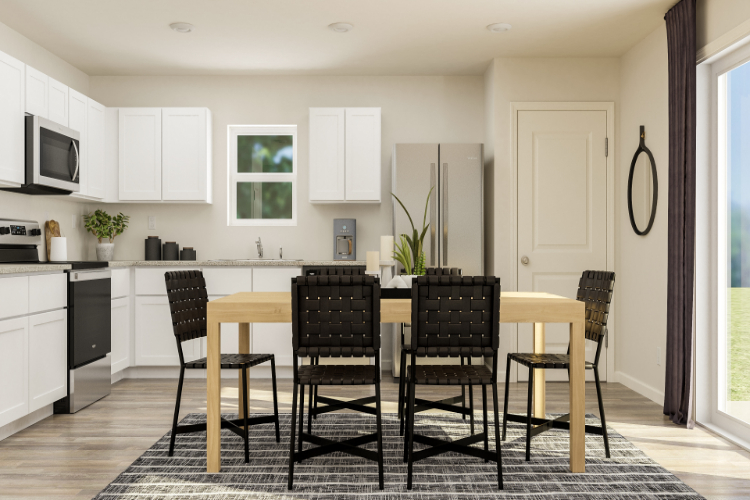 A kitchen with a dining table and chairs.