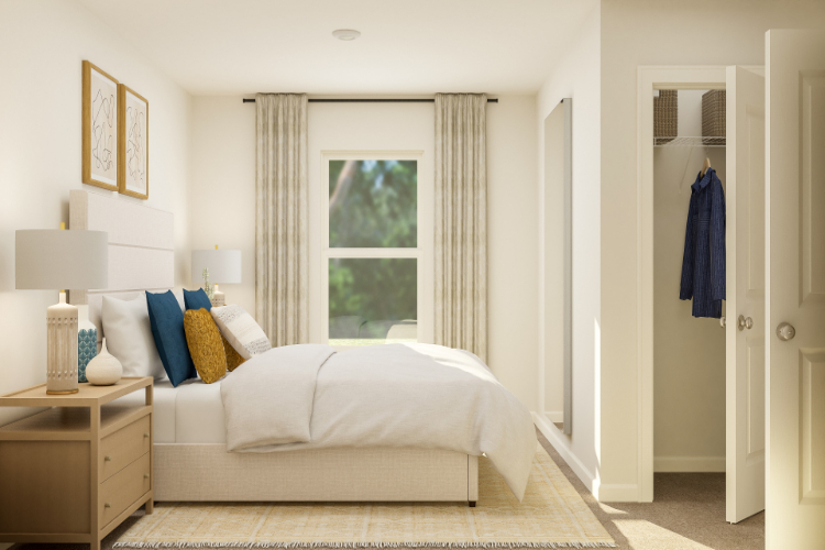 A bedroom with a bed and a window.