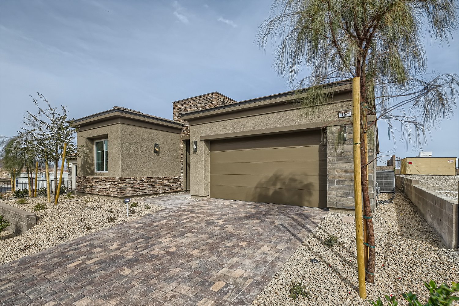 A building with a dirt yard.