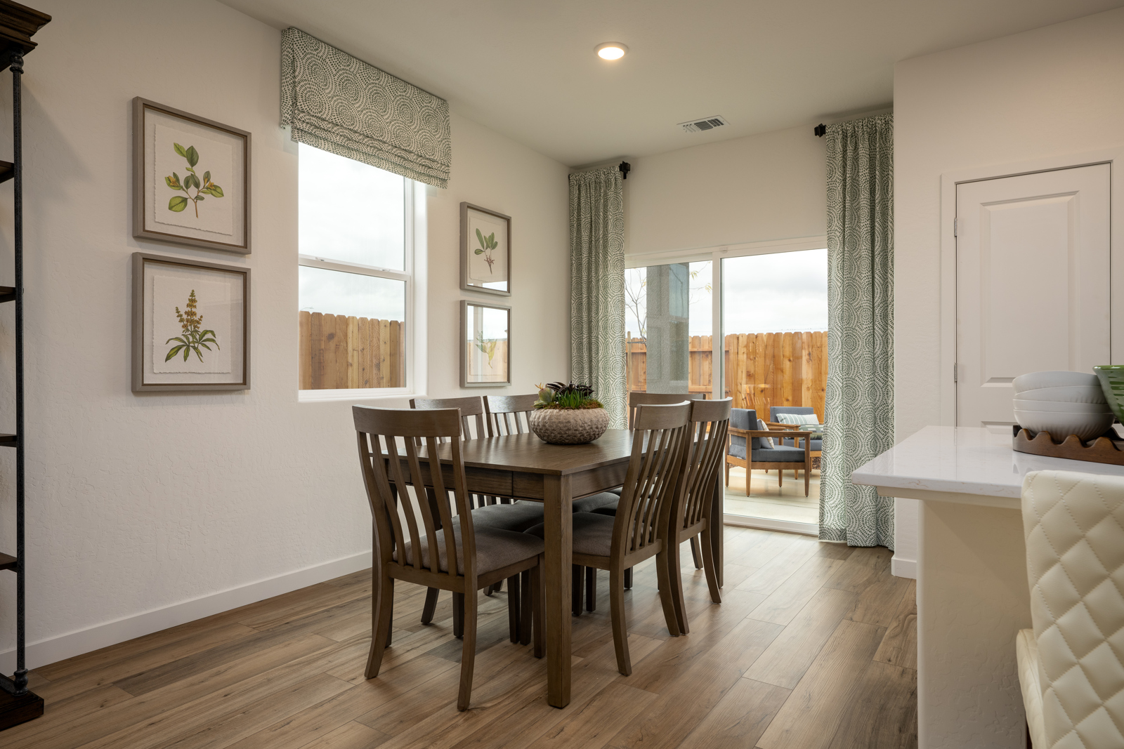 A dining room with a large window.