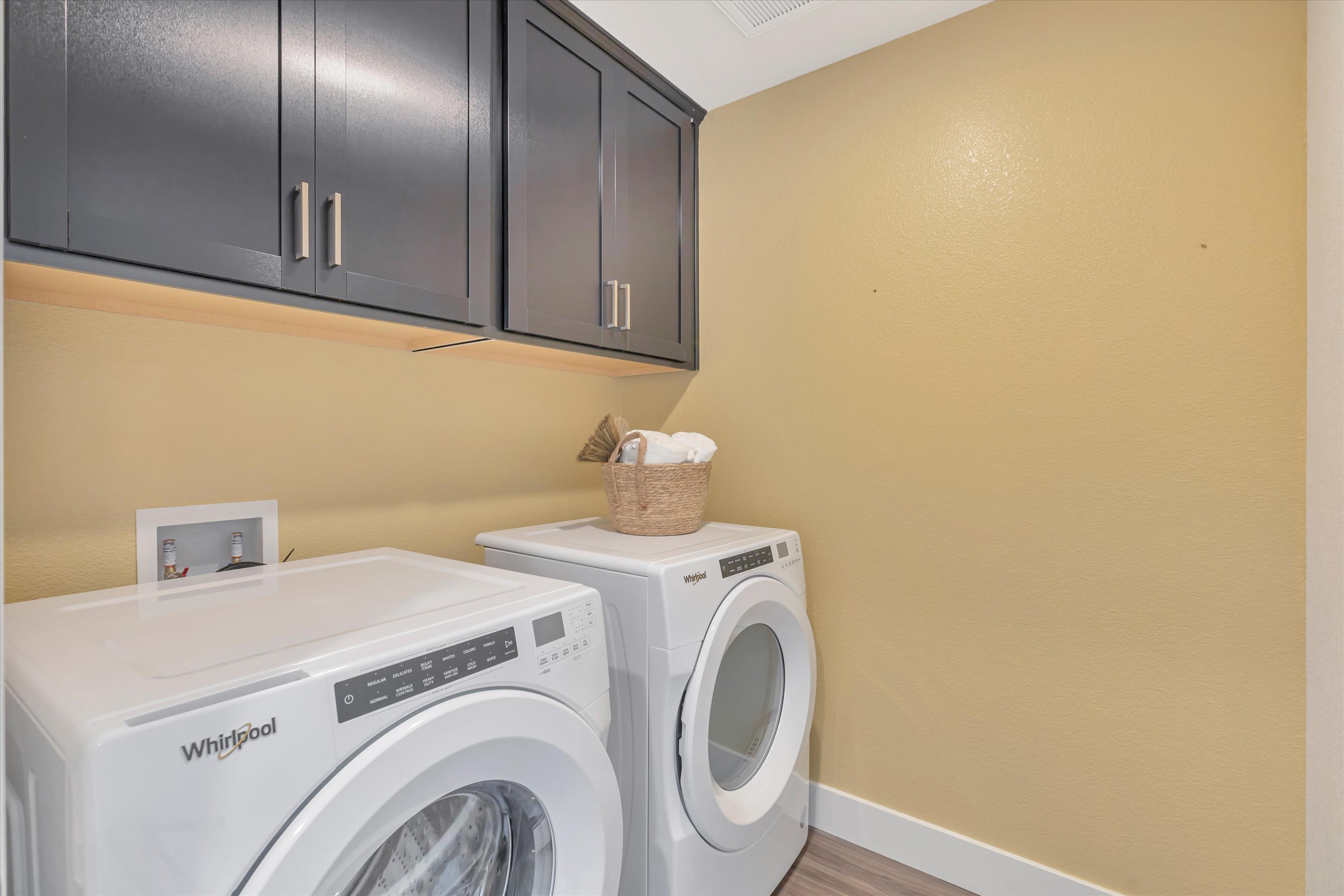 A laundry room with a dryer and dryer.