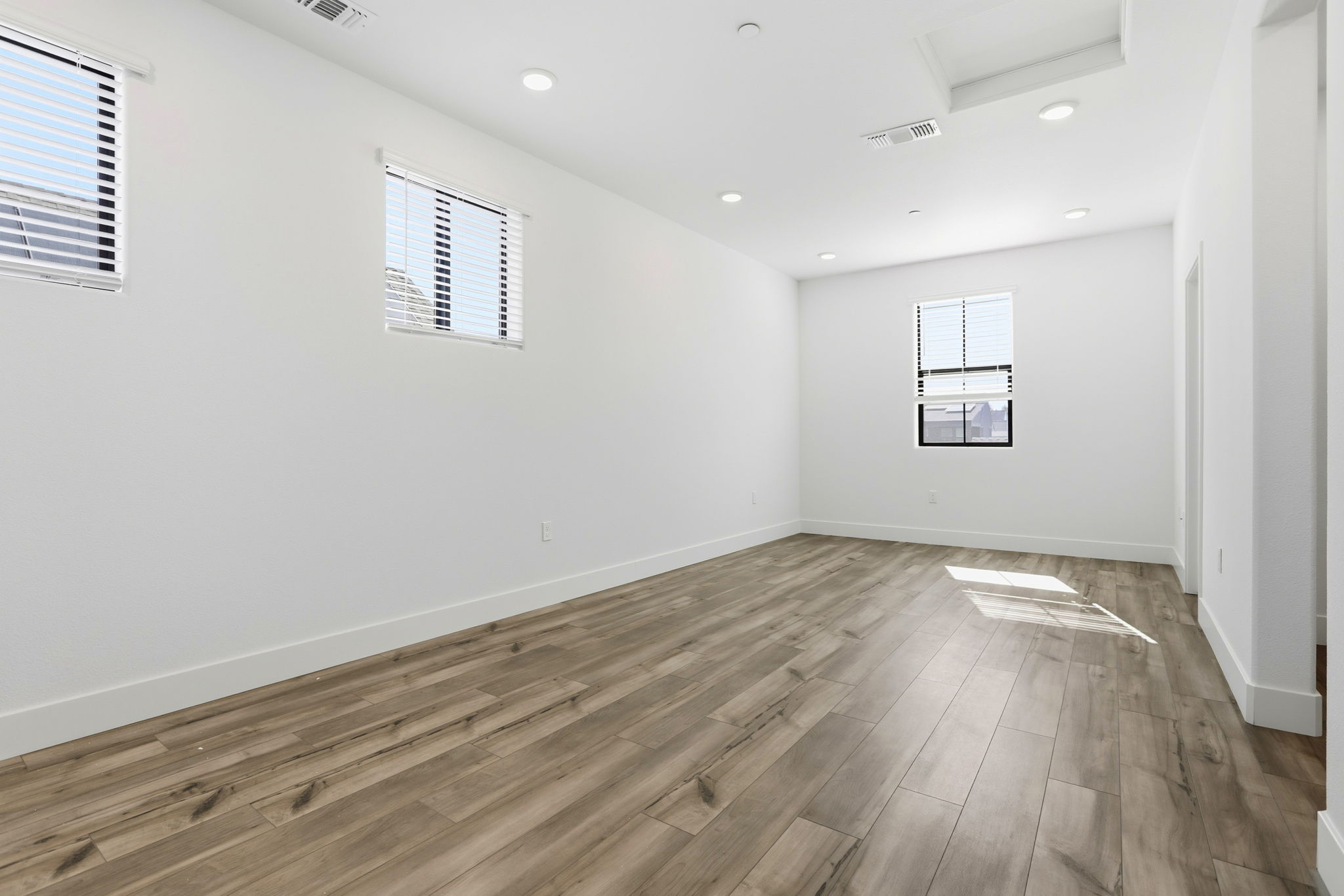 A room with a wood floor and a wood floor.