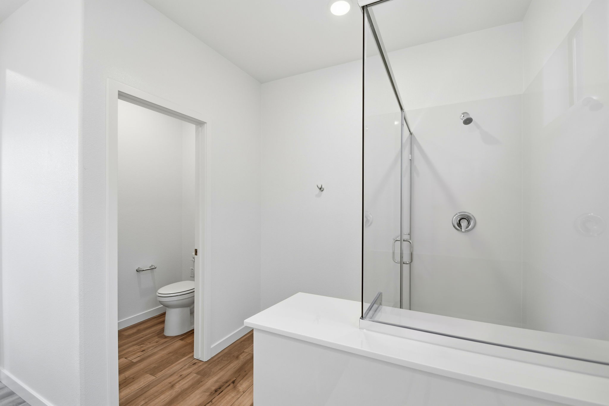 A bathroom with a glass shower.