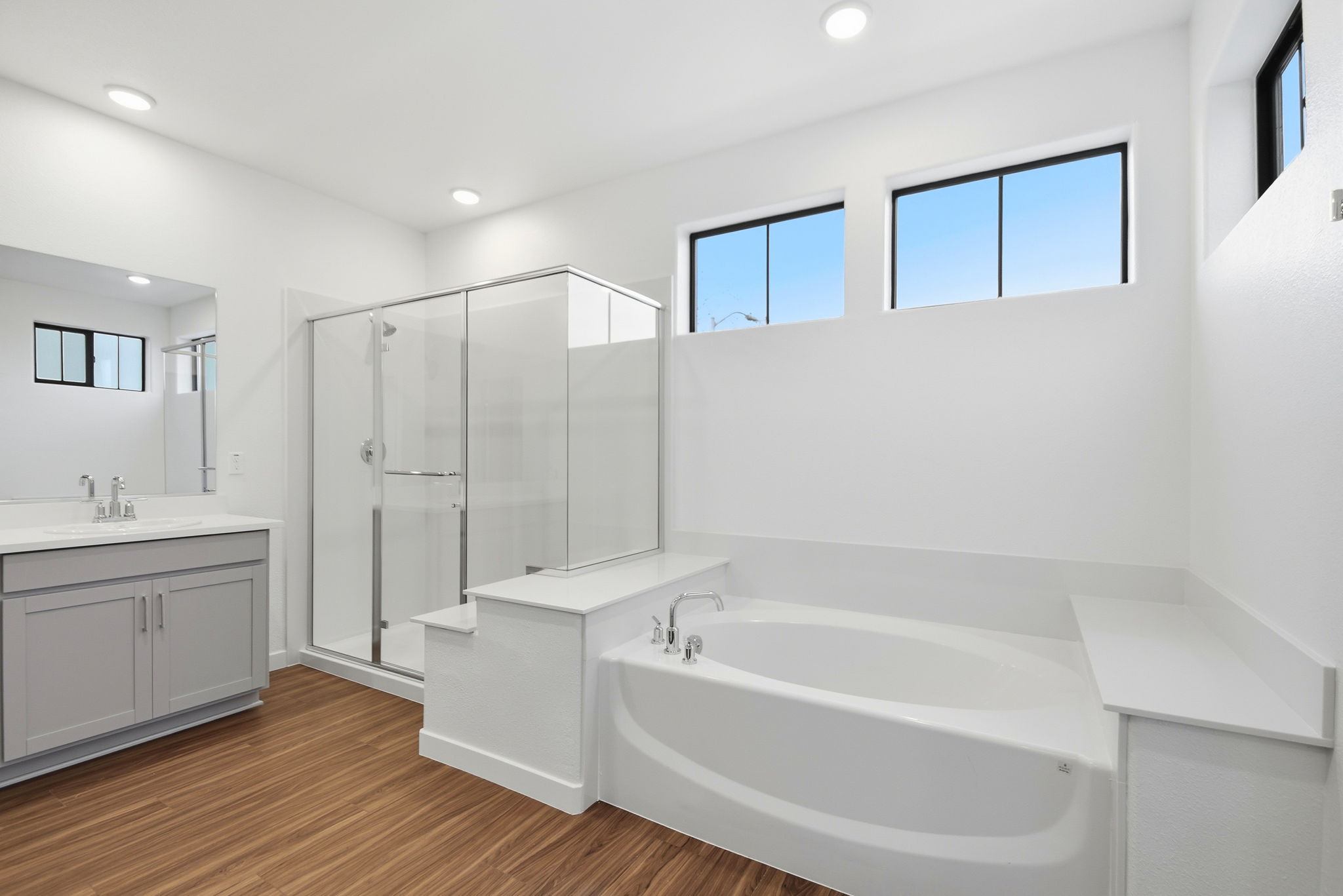 A bathroom with a tub and sink.