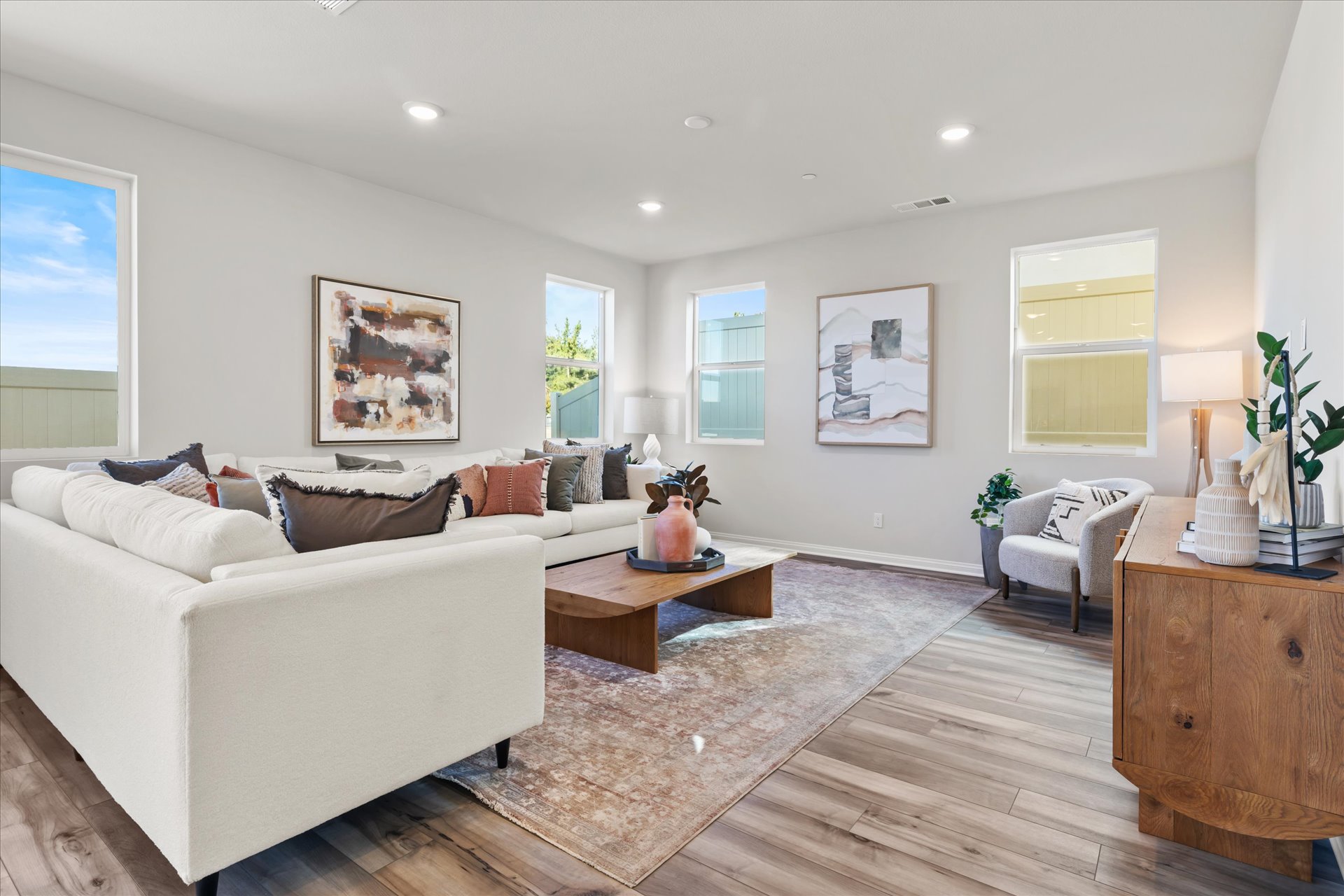 A living room with a white couch.