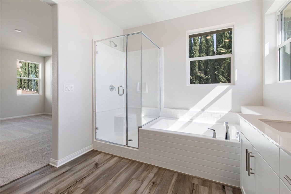 A bathroom with a glass shower.