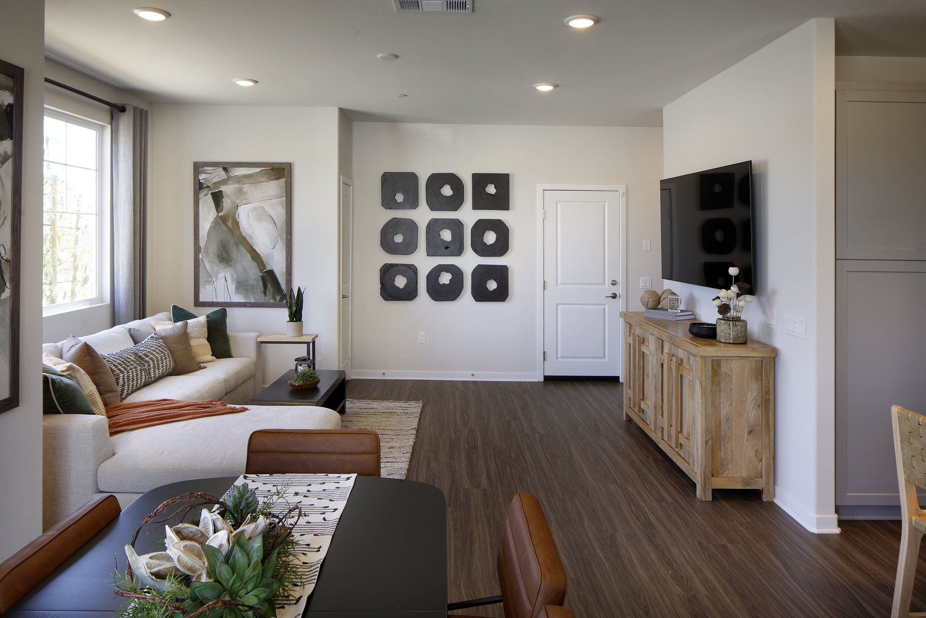 A living room with a couch and a table.