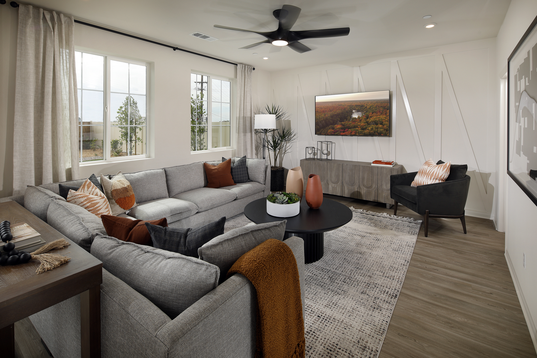 A living room with a couch and a table.