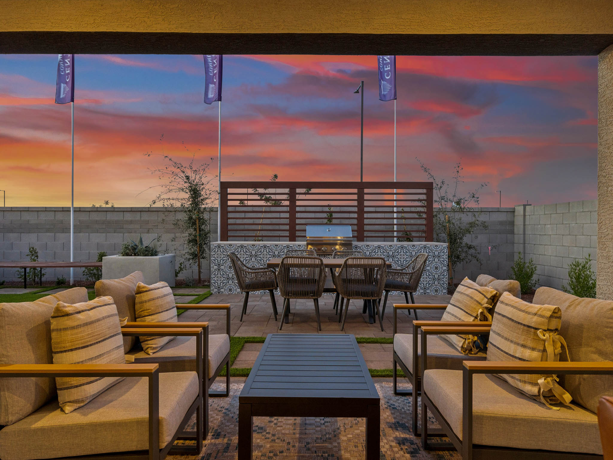 A room with a pool table and chairs and a sunset.