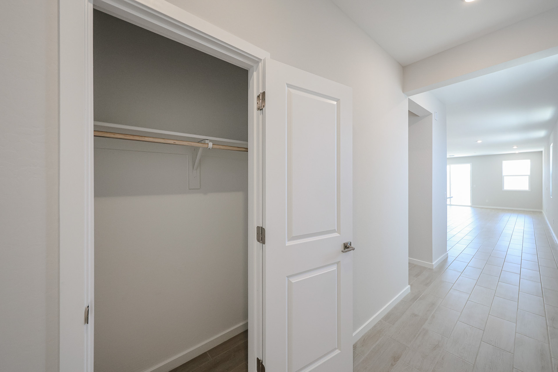 A hallway with white doors.