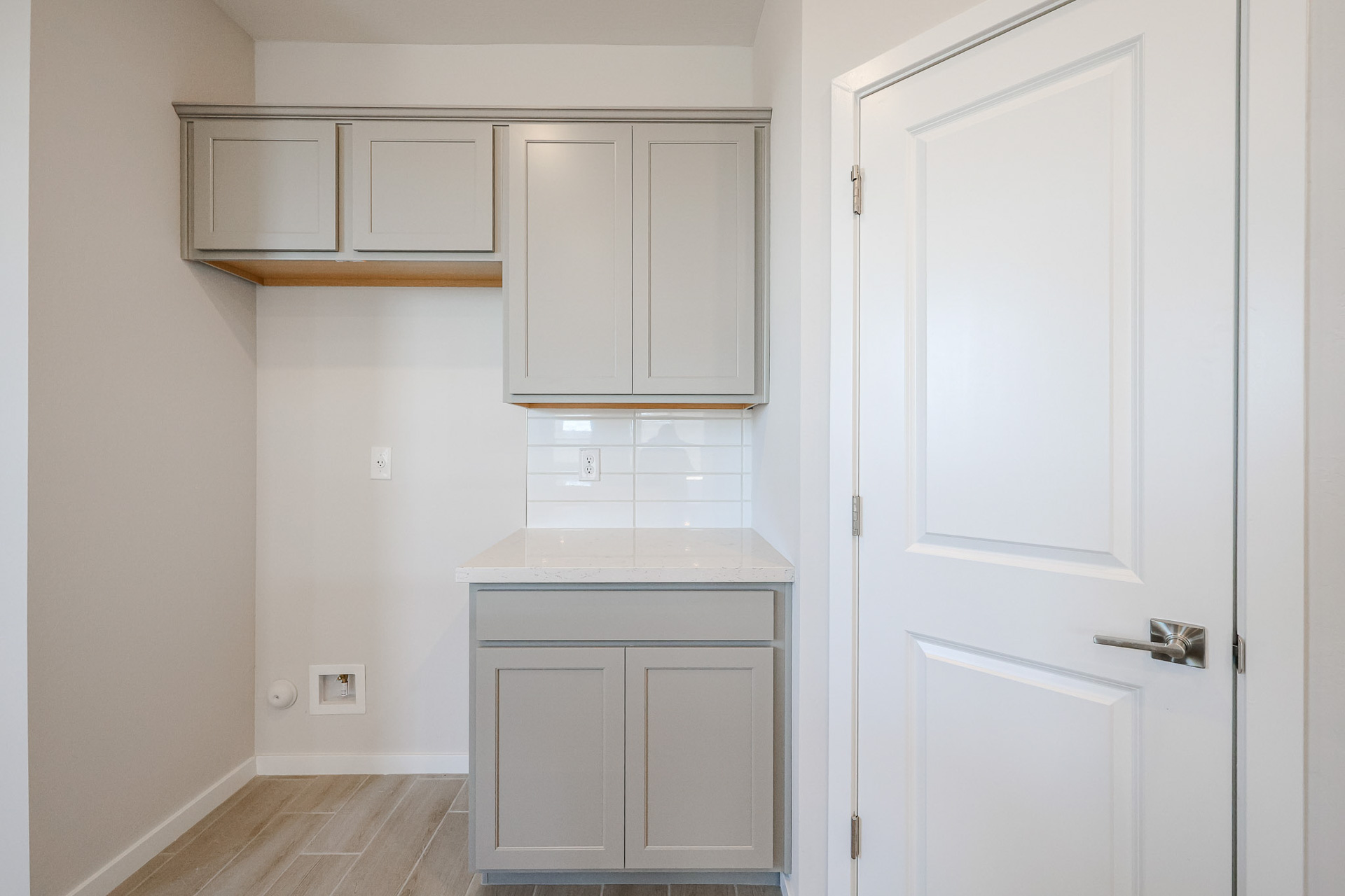 A white kitchen with white cabinets.