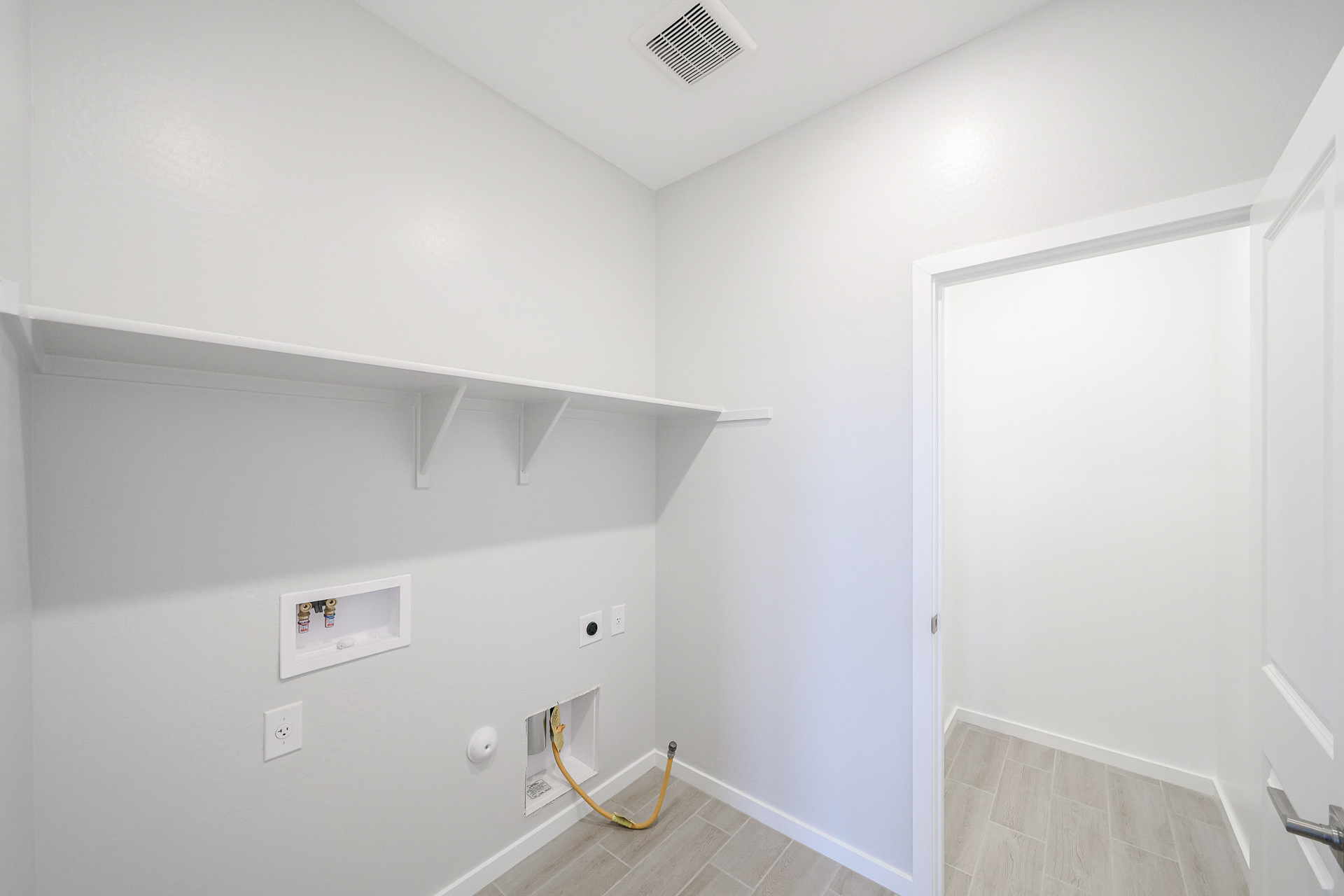 A white room with a white door.