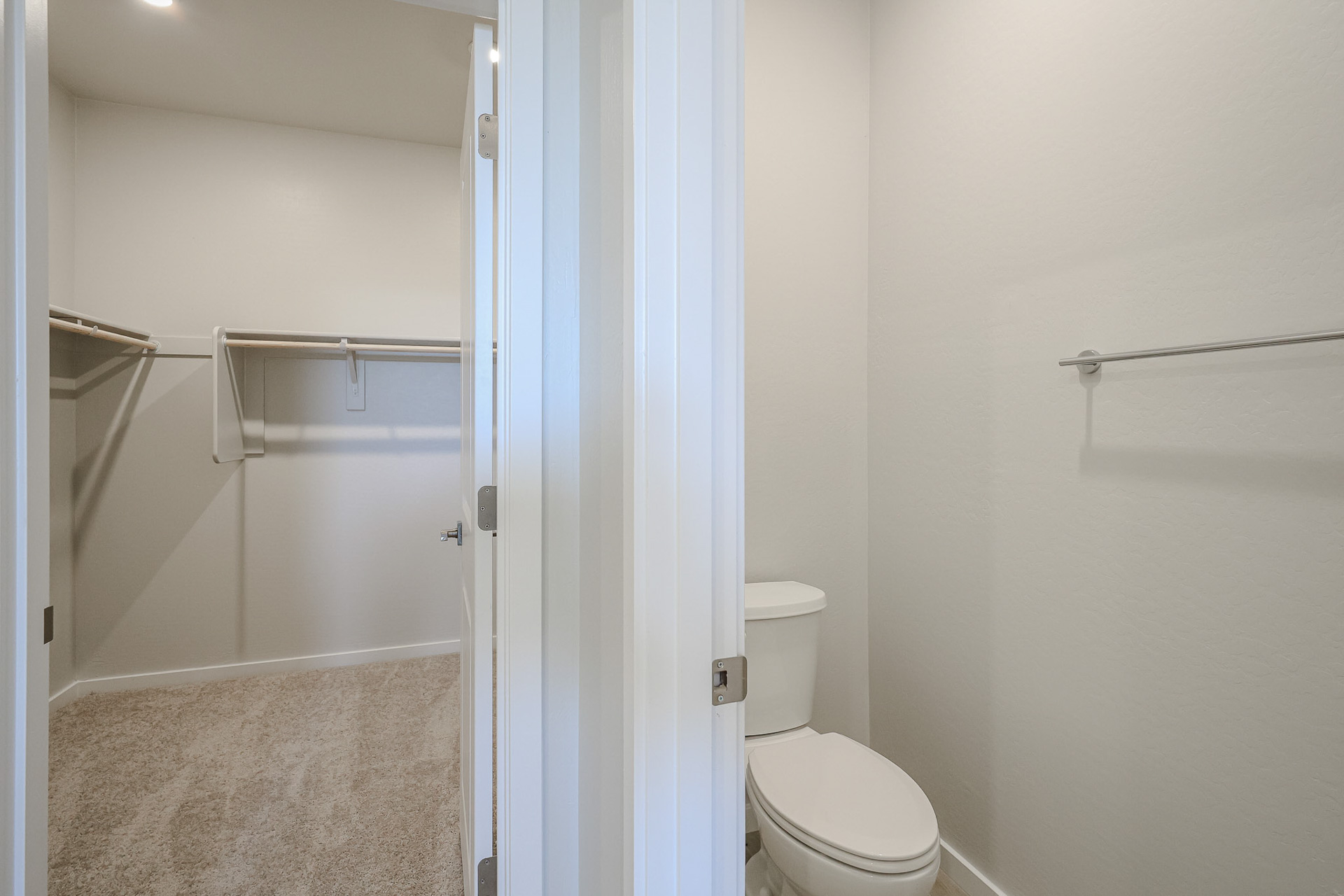 A bathroom with a toilet and shower.