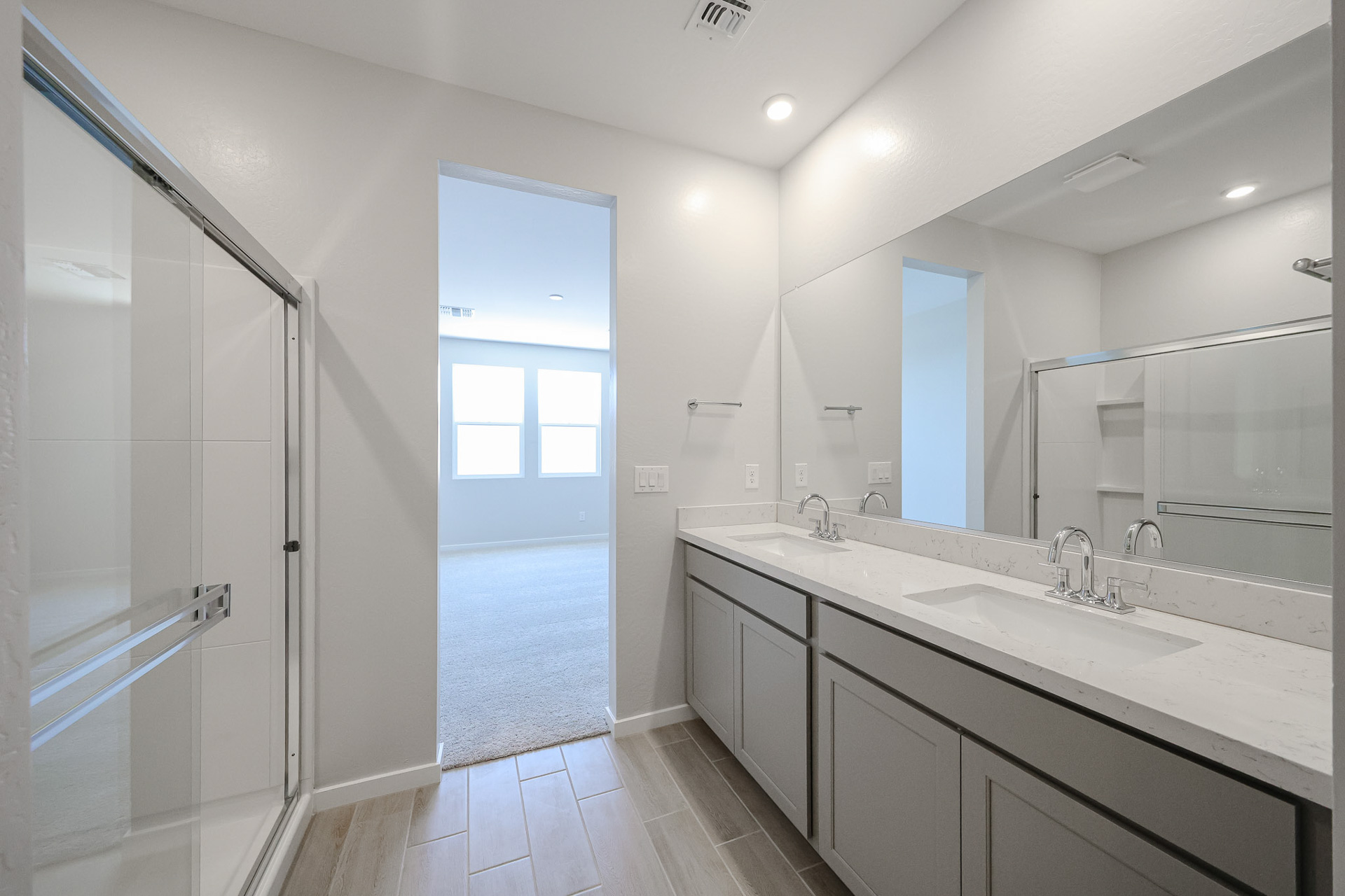 A bathroom with a glass shower.