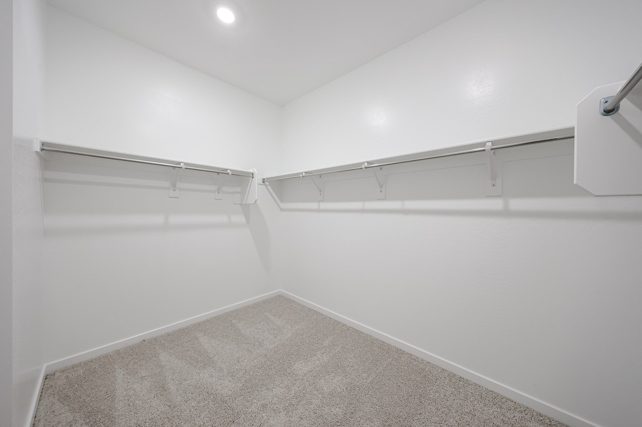 A white wall with a light on it.