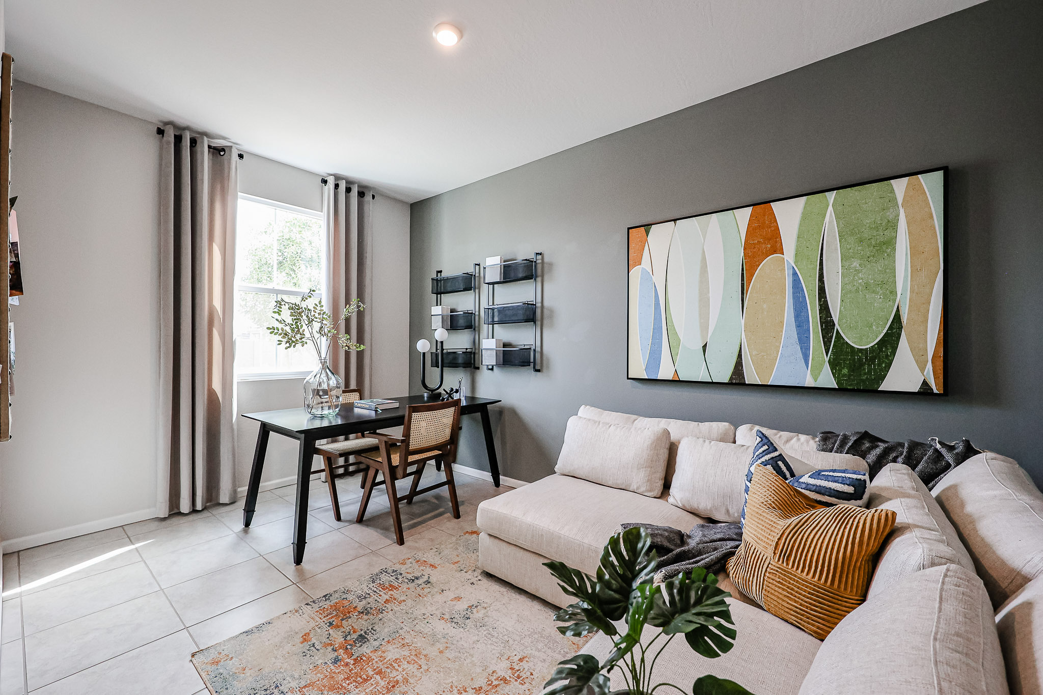 A living room with a couch and a table.