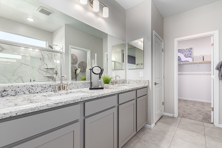 A bathroom with a marble countertop.