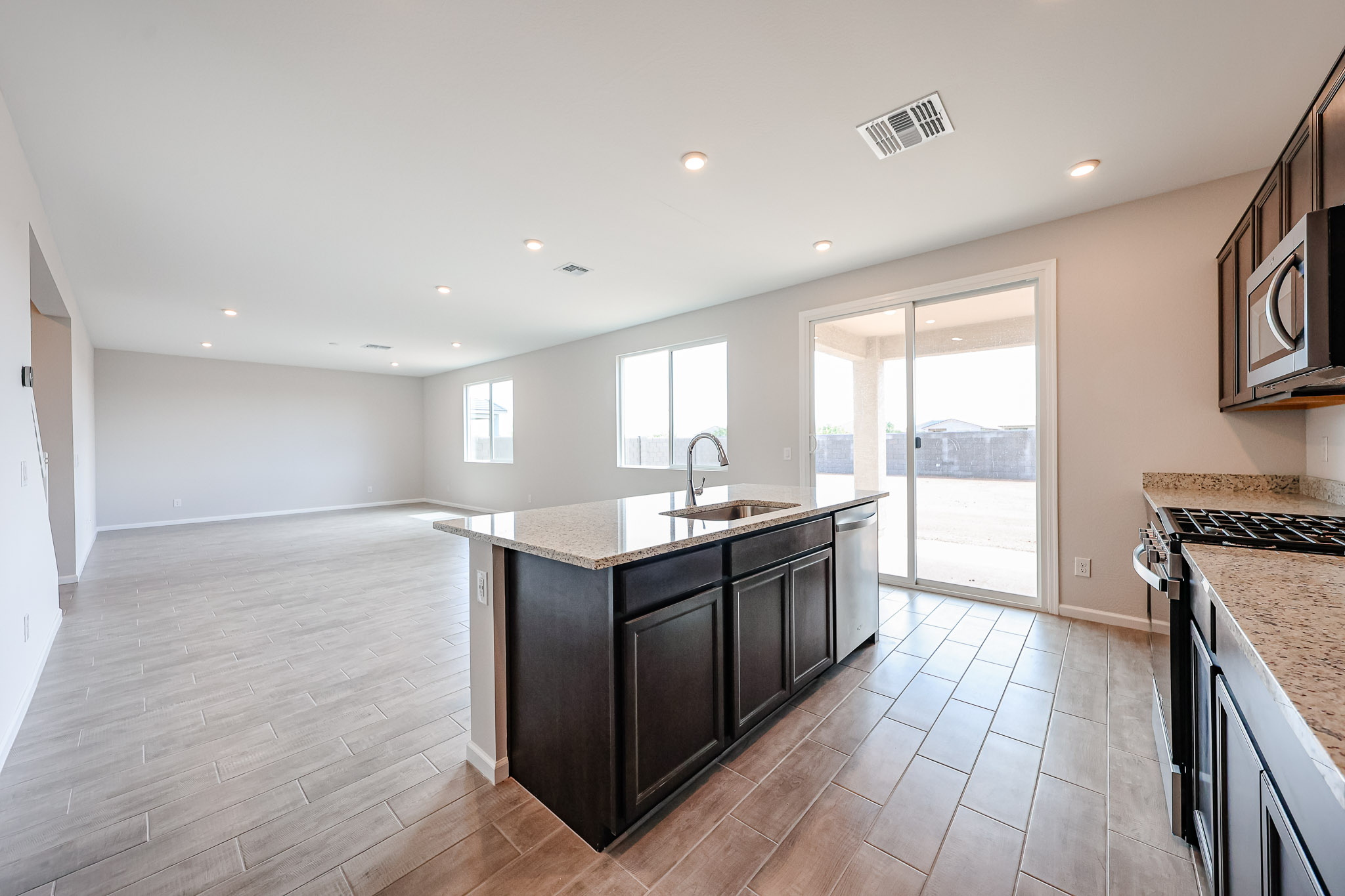 A kitchen with a wood floor.