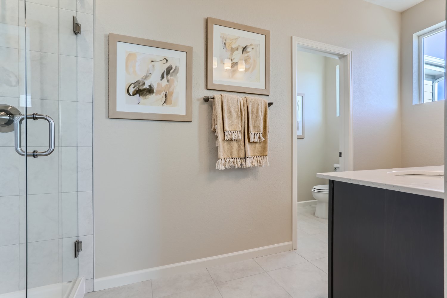 A bathroom with a glass shower.