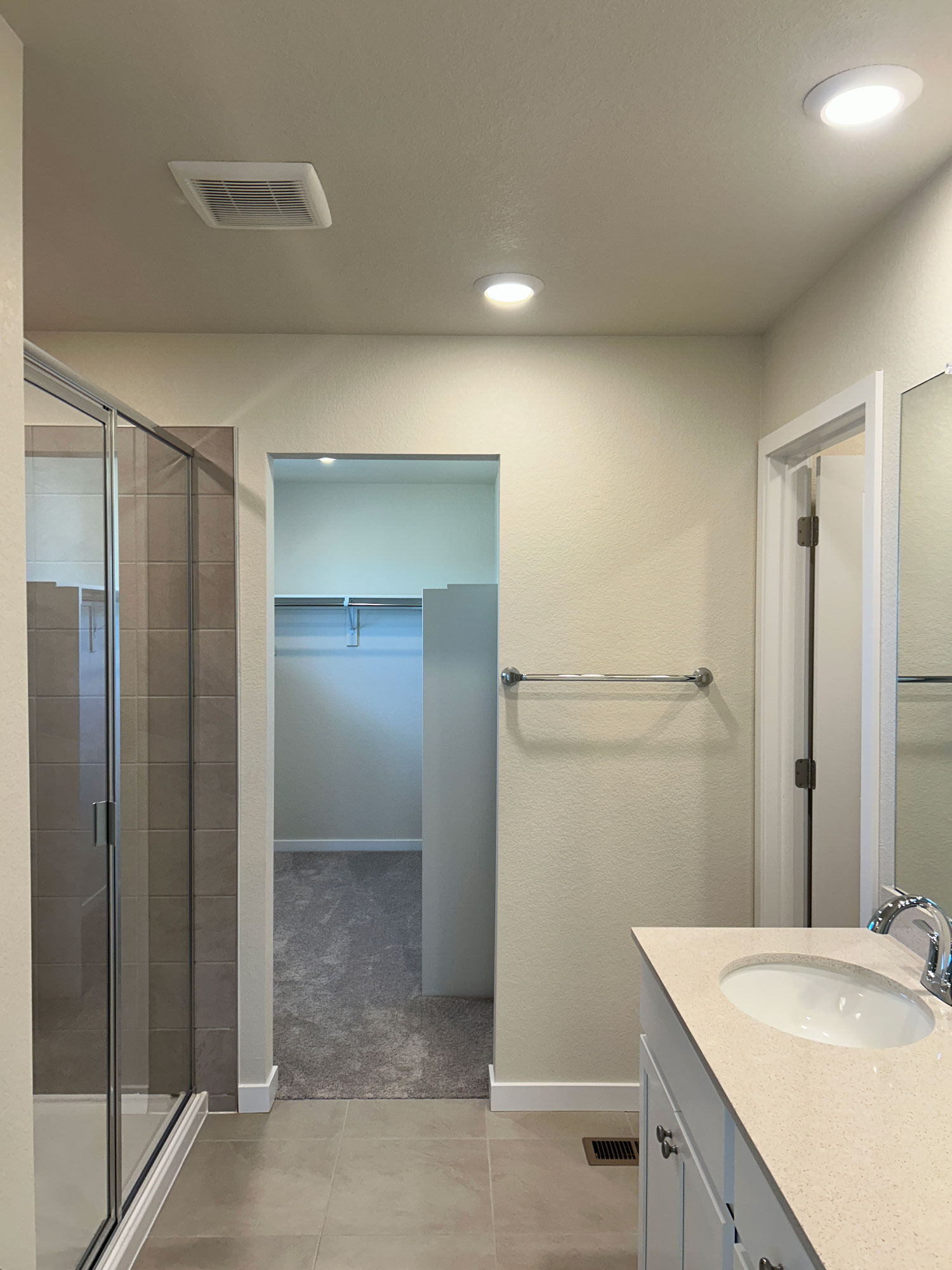 A bathroom with a glass shower.
