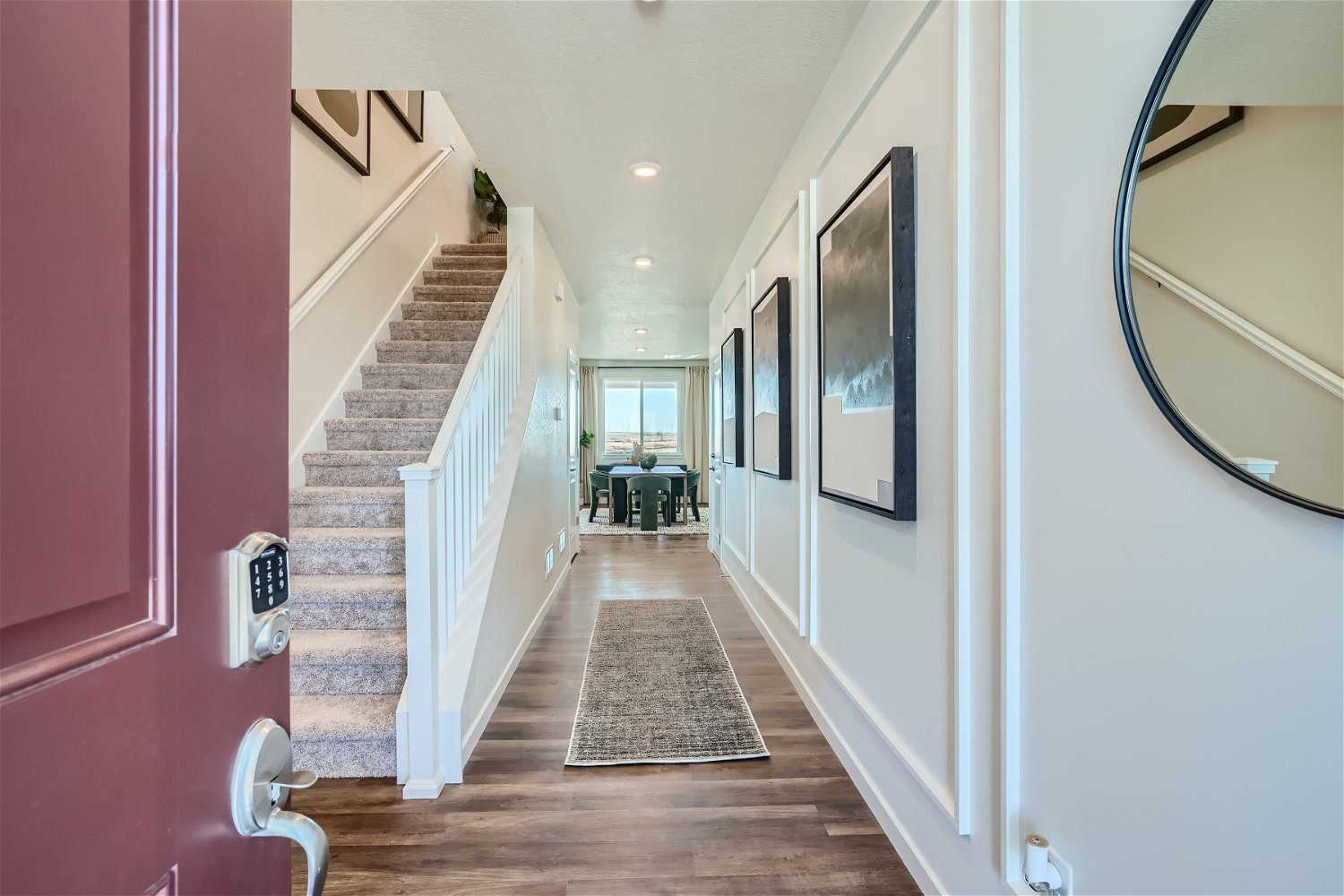 A hallway with a wood floor.
