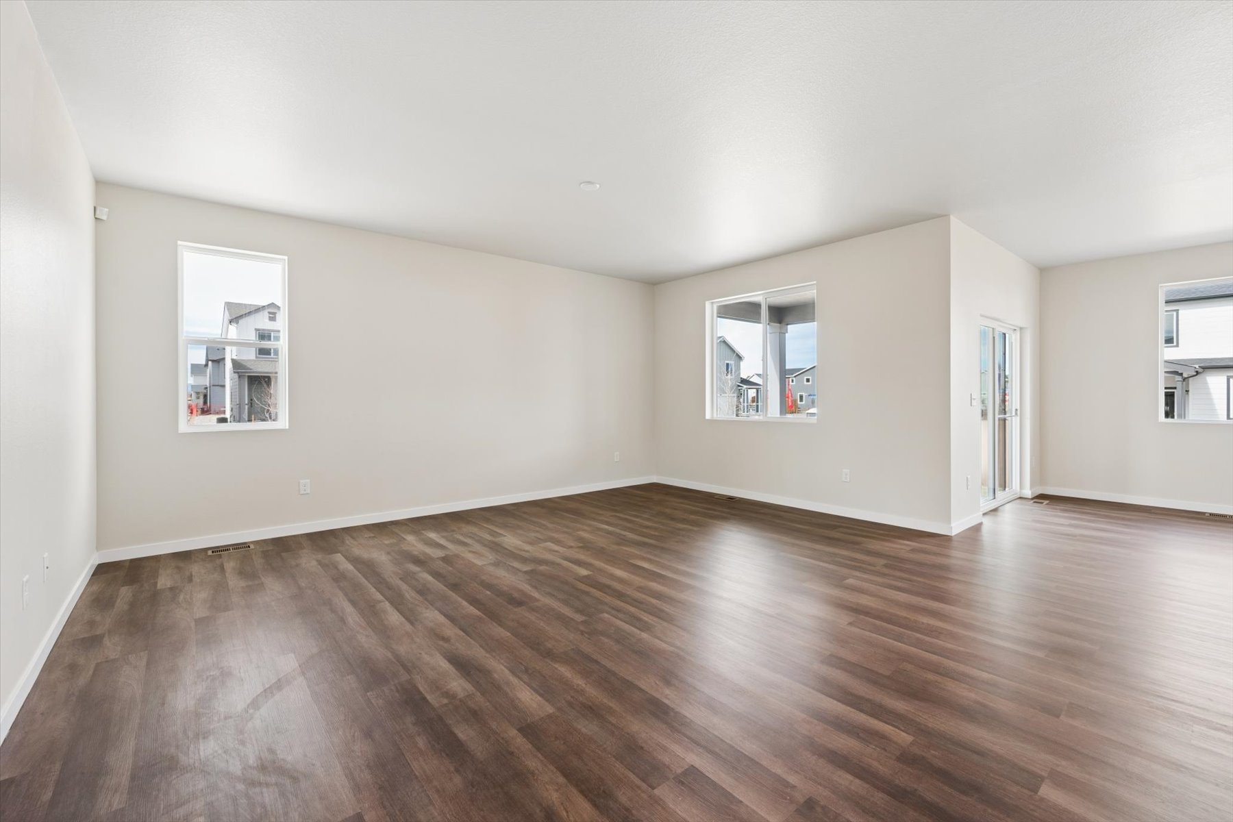 A room with a wood floor and a wood floor.
