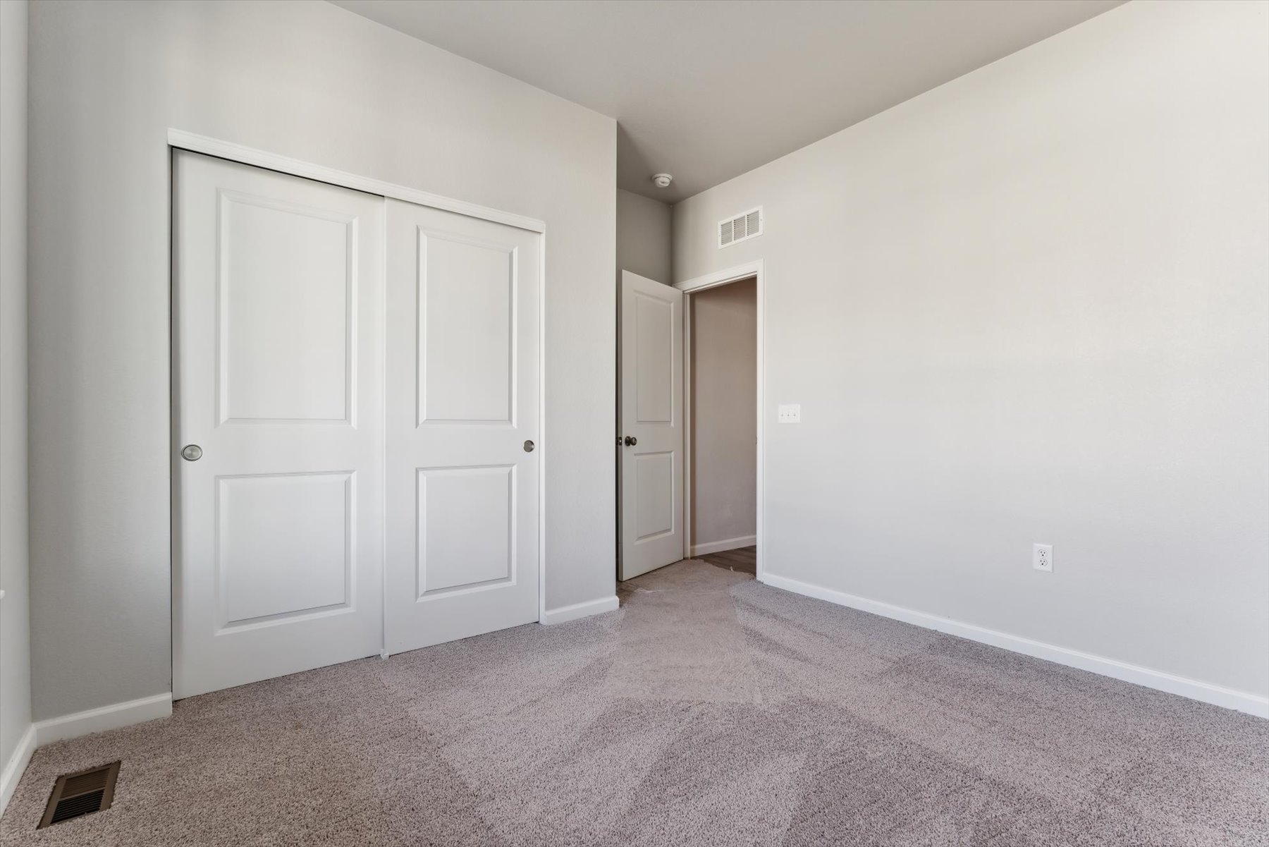 A room with white doors.