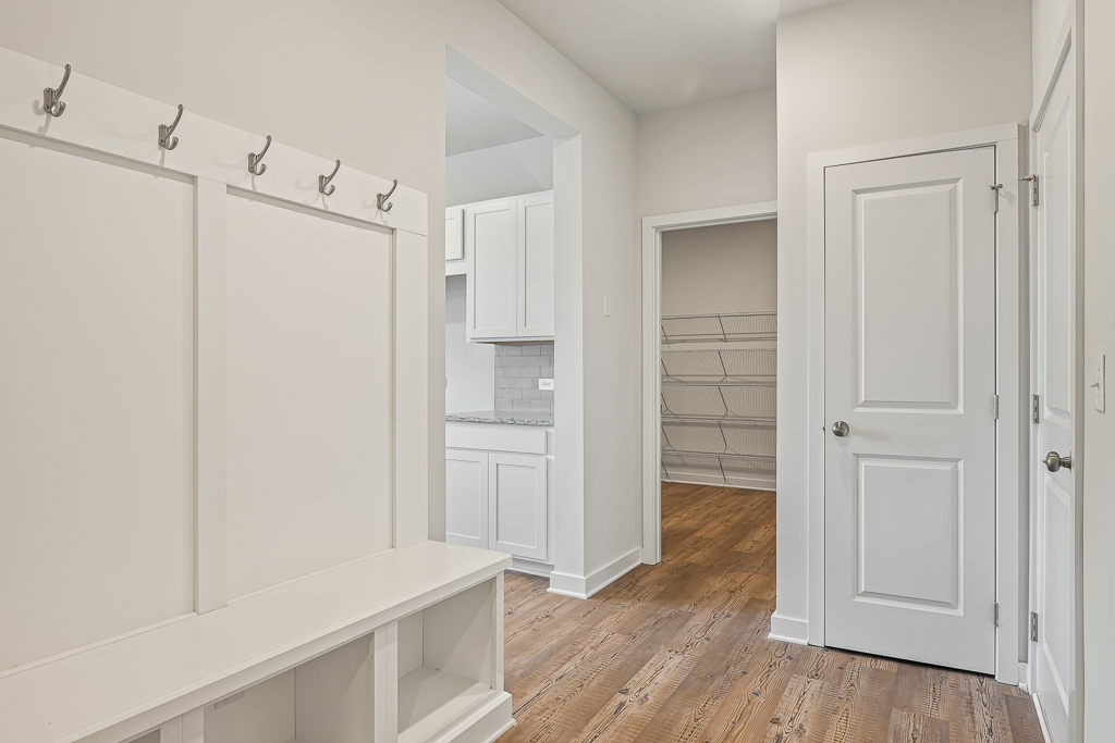 A white kitchen with white cabinets.