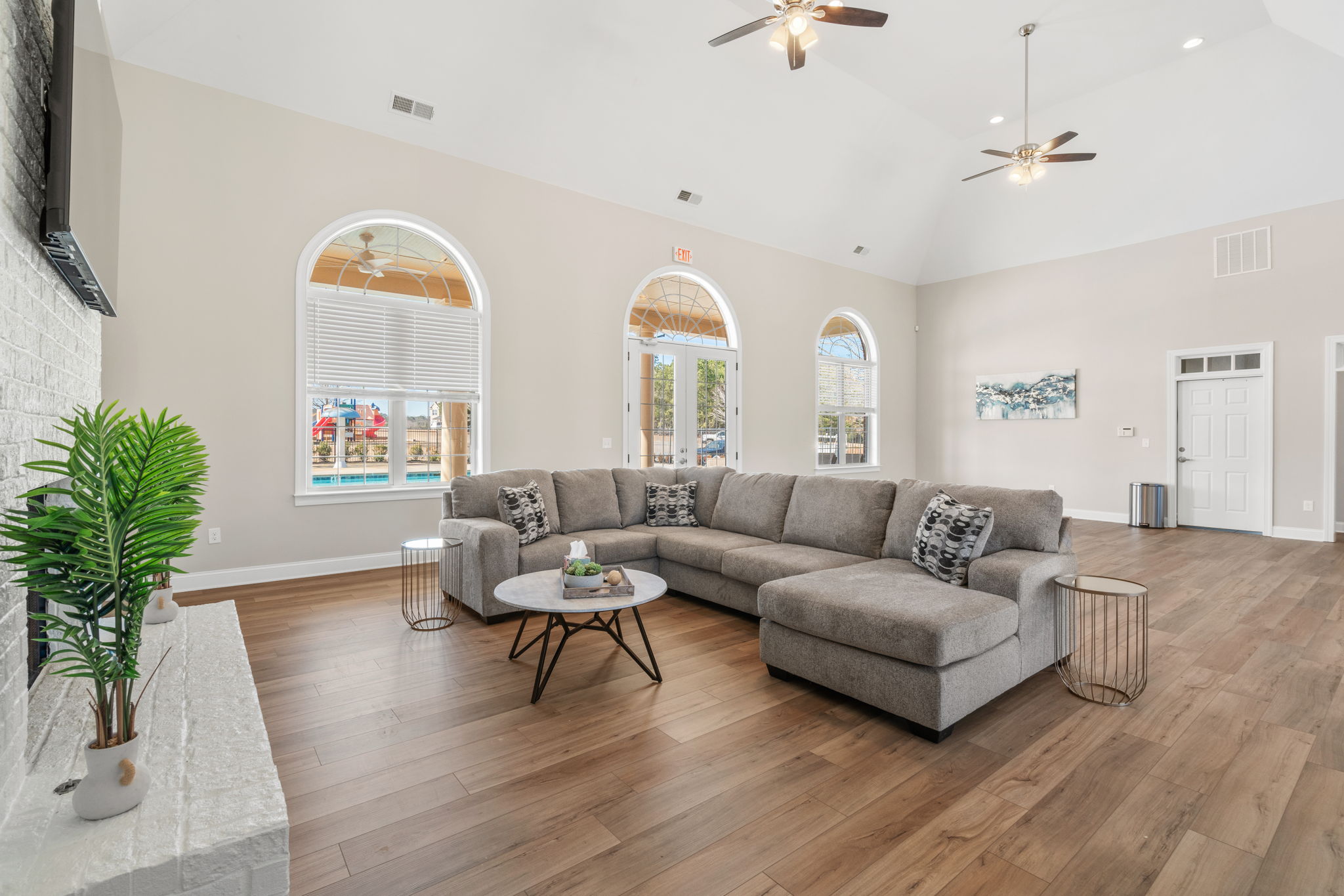 A living room with a couch and a table.