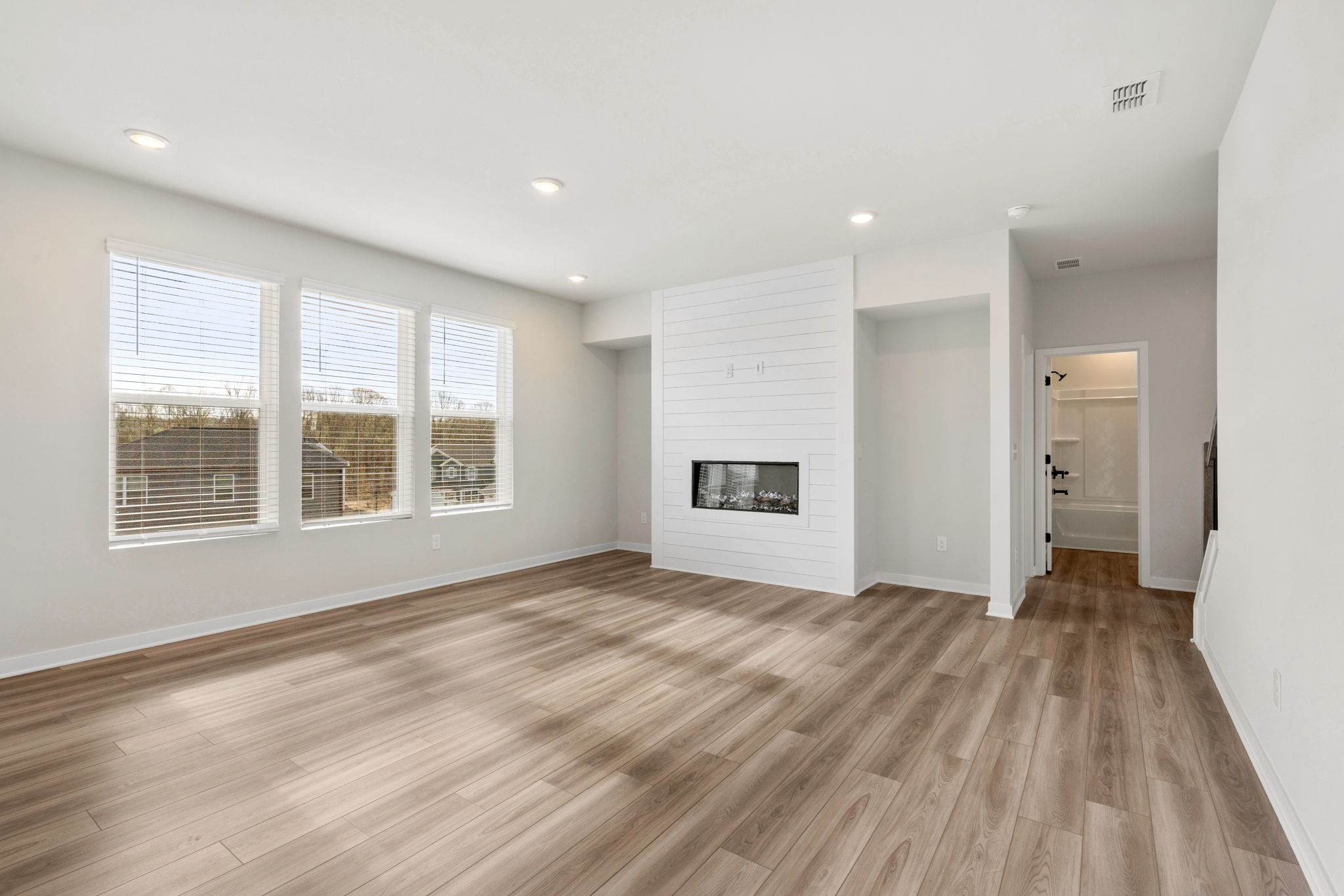 A room with a wood floor and a wood floor.