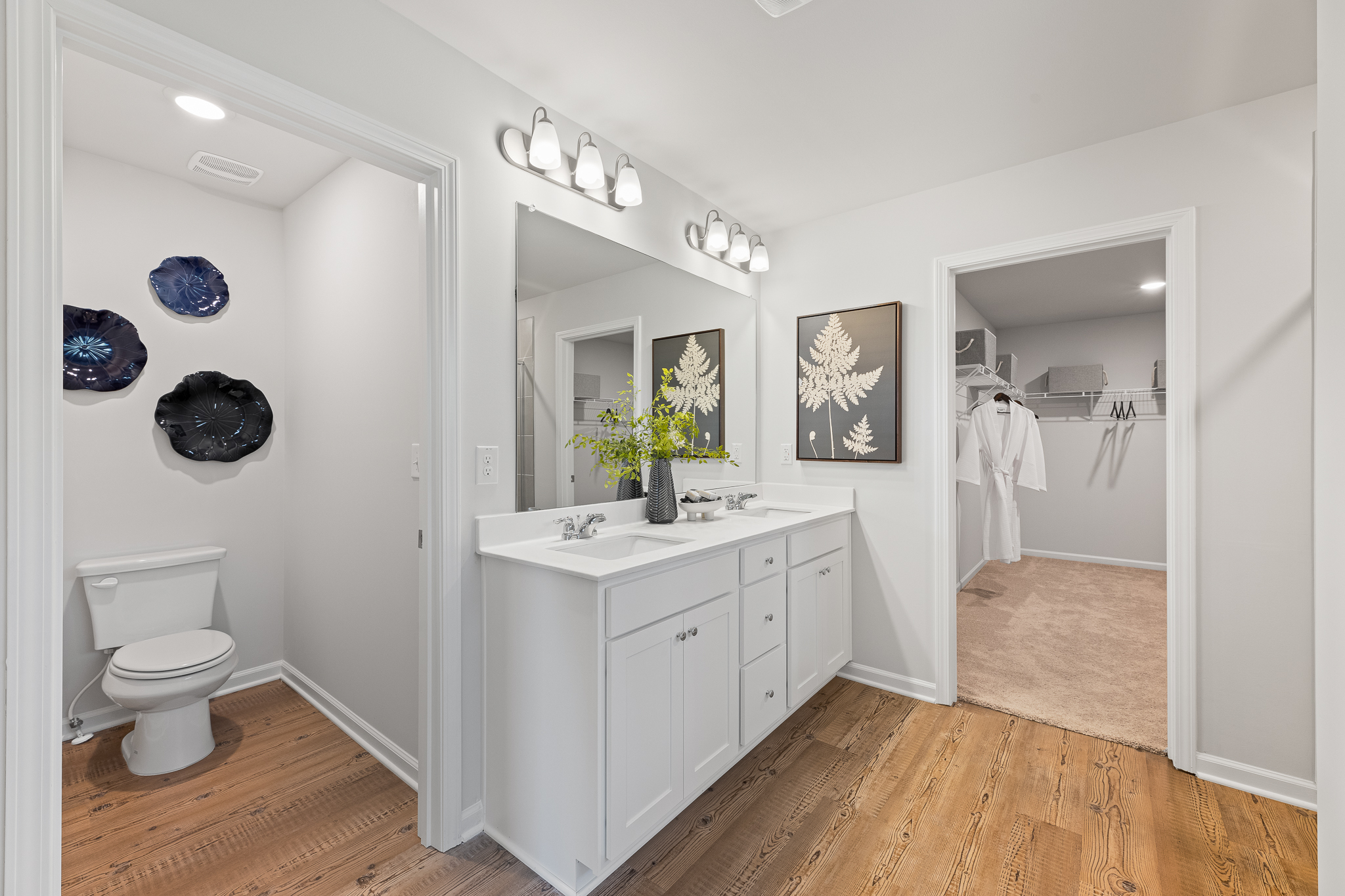 A bathroom with a toilet and sink.