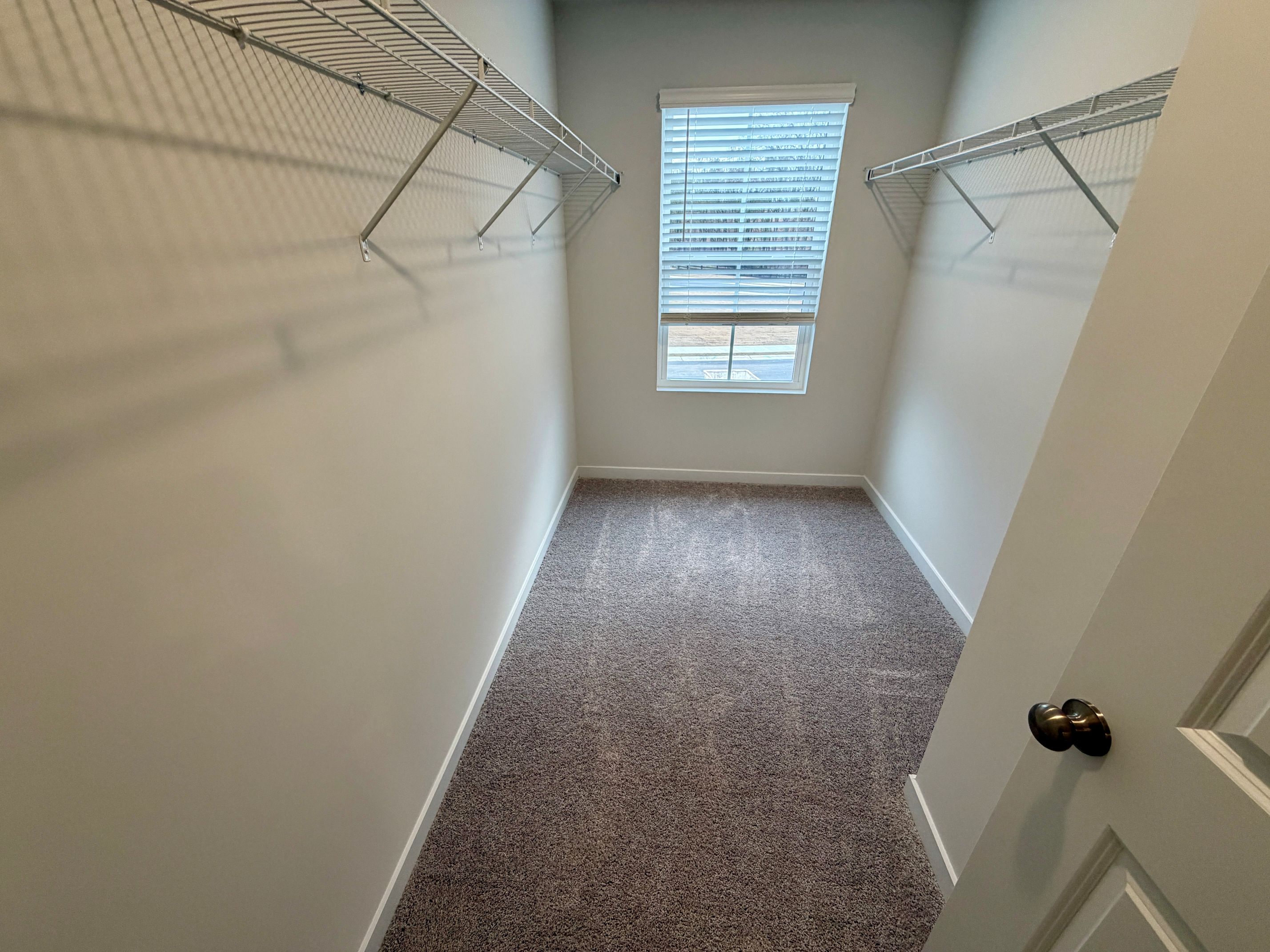 A hallway with a window.