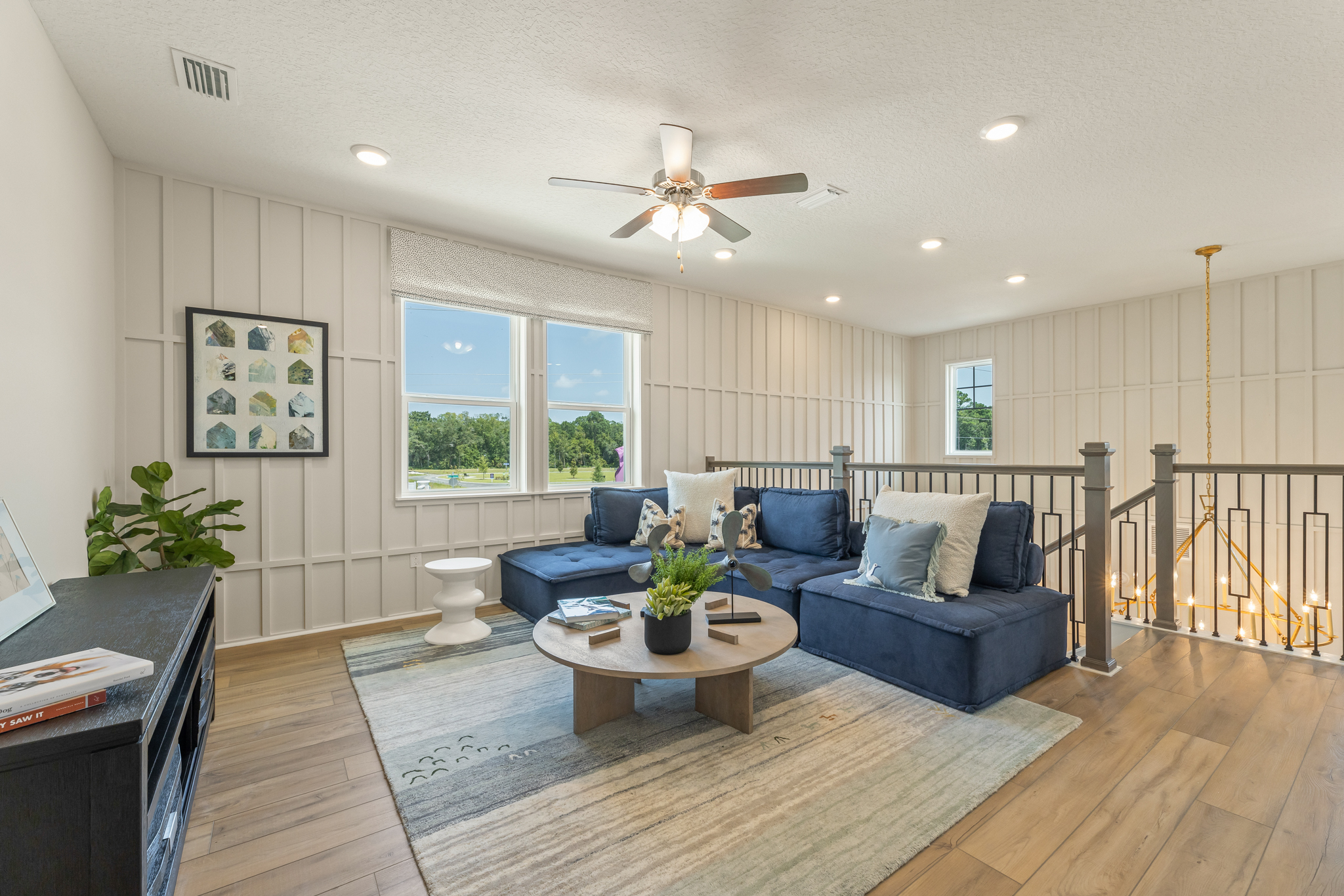 A living room with a wood floor.