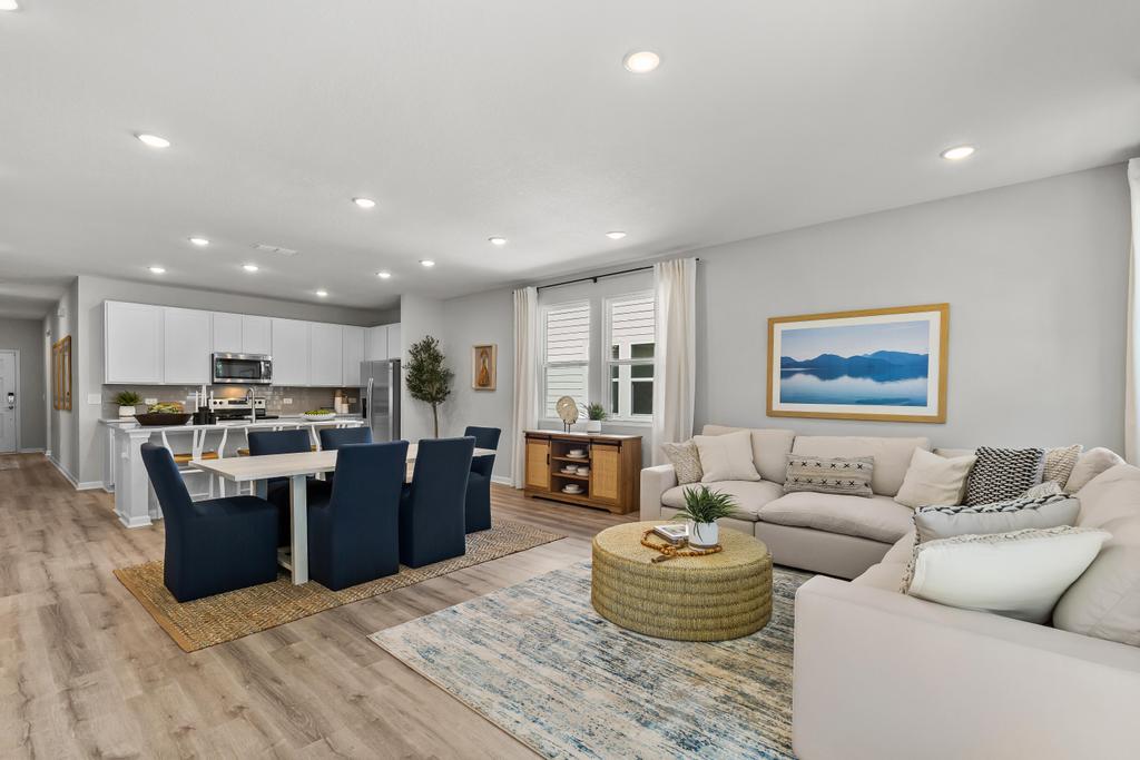 A large living room with a large kitchen and dining area.