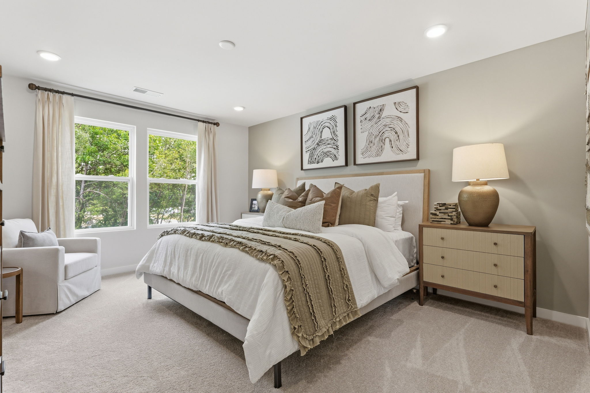 A bedroom with a bed and a couch.