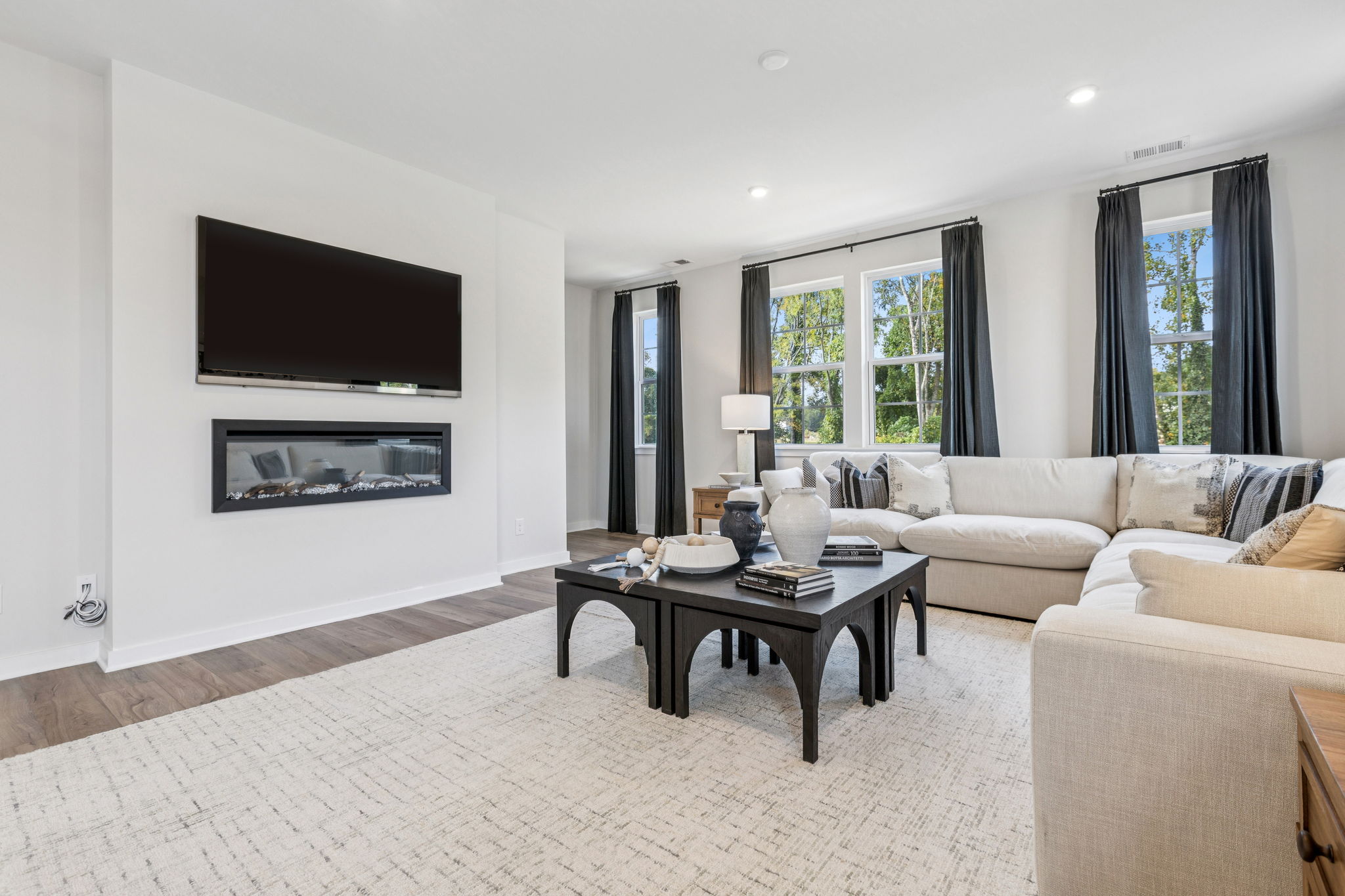 A living room with a large tv.