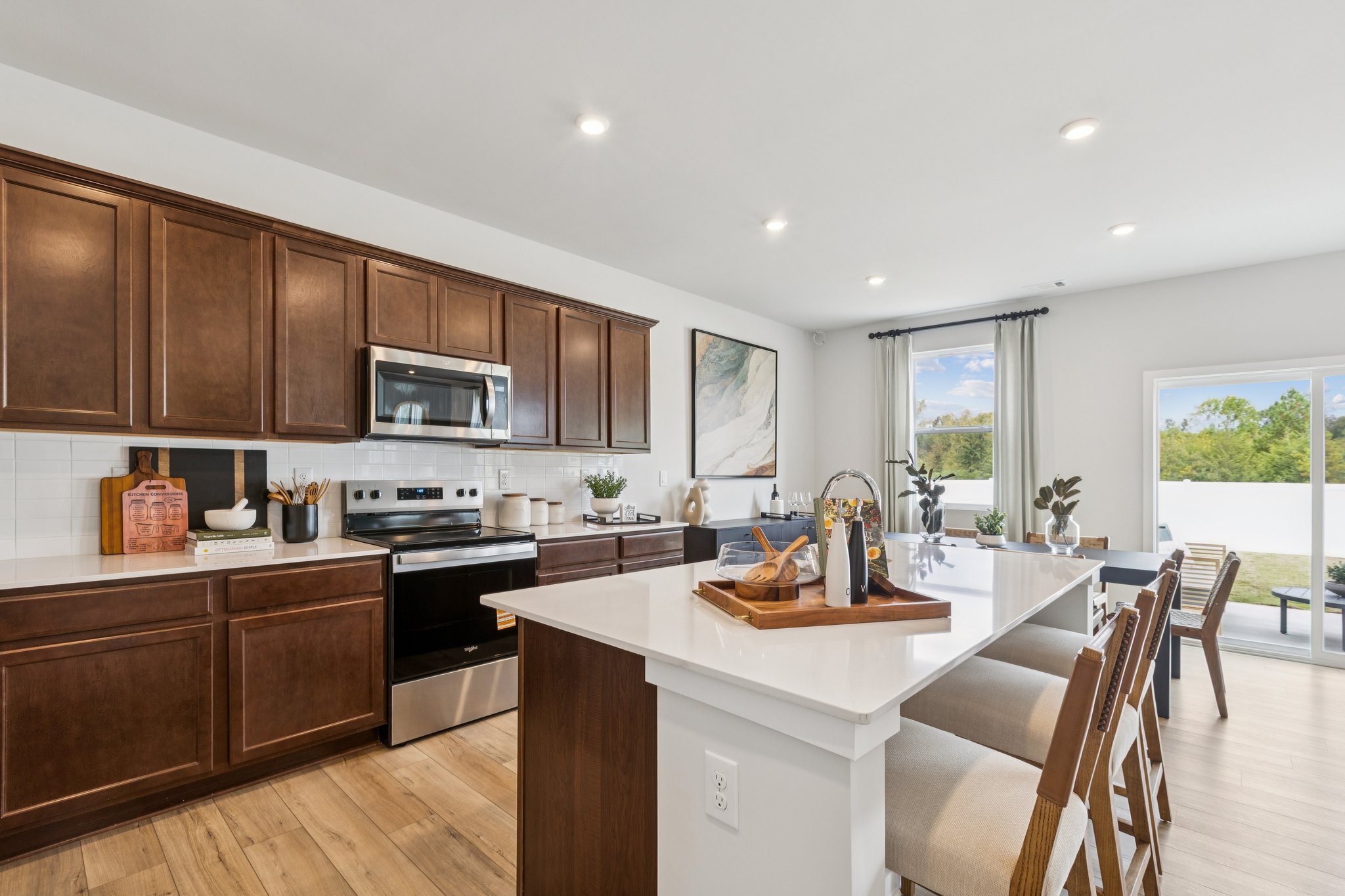 A kitchen with wooden cabinets.