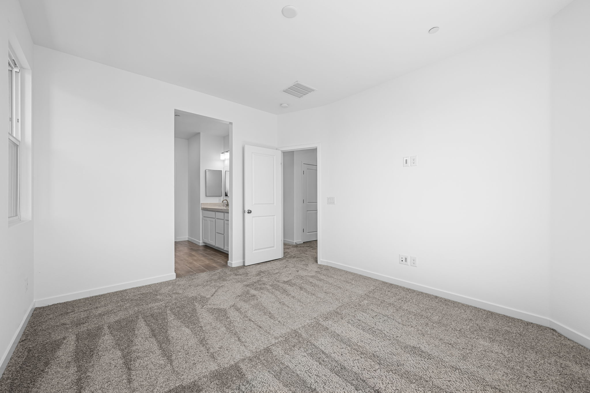 A hallway with white walls.