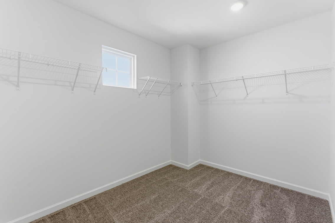 A white room with a staircase.