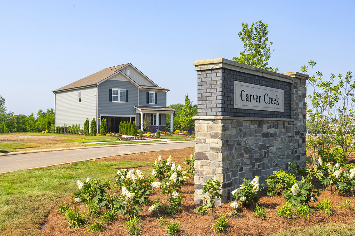 A house with a sign on the front.