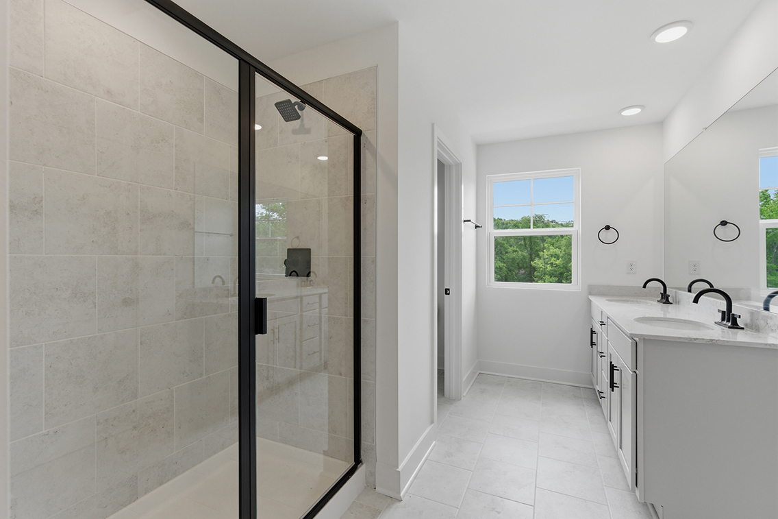 A bathroom with a glass shower.