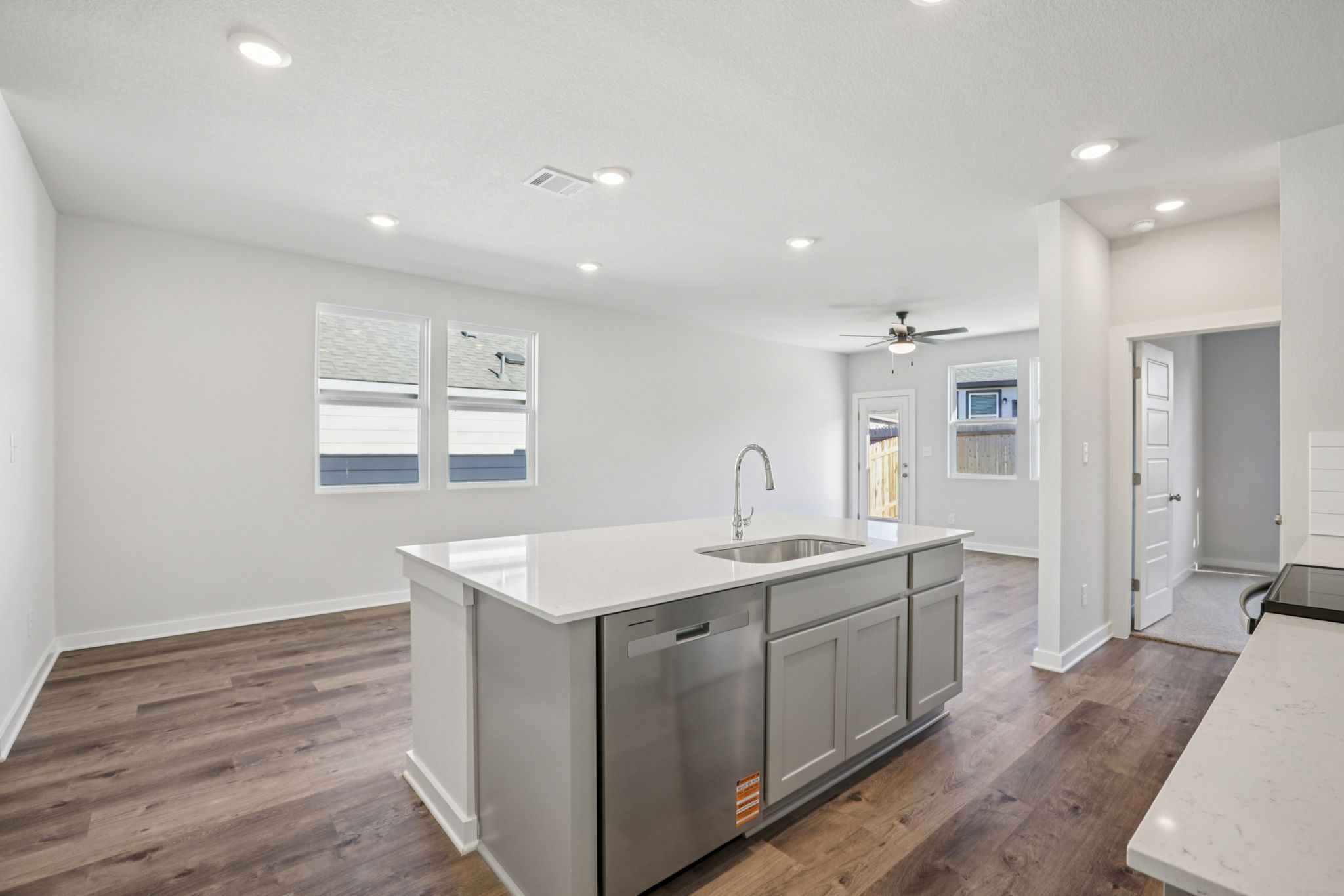A kitchen with a sink and cabinets.