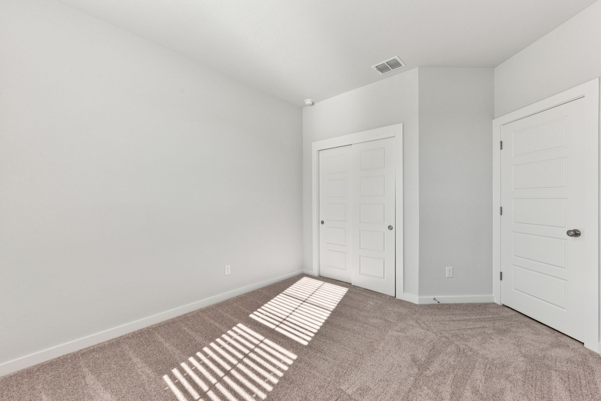 A room with white doors.