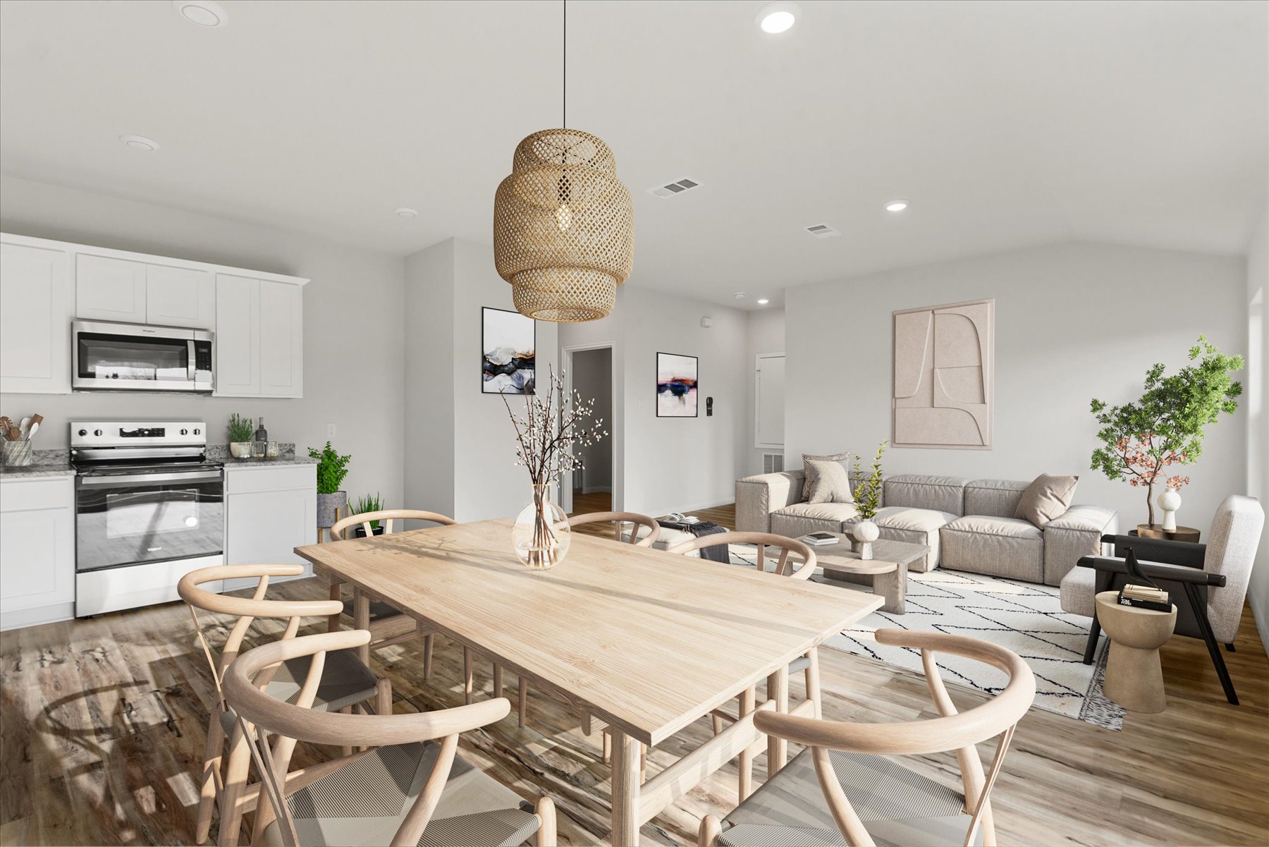A dining room with a table and chairs.