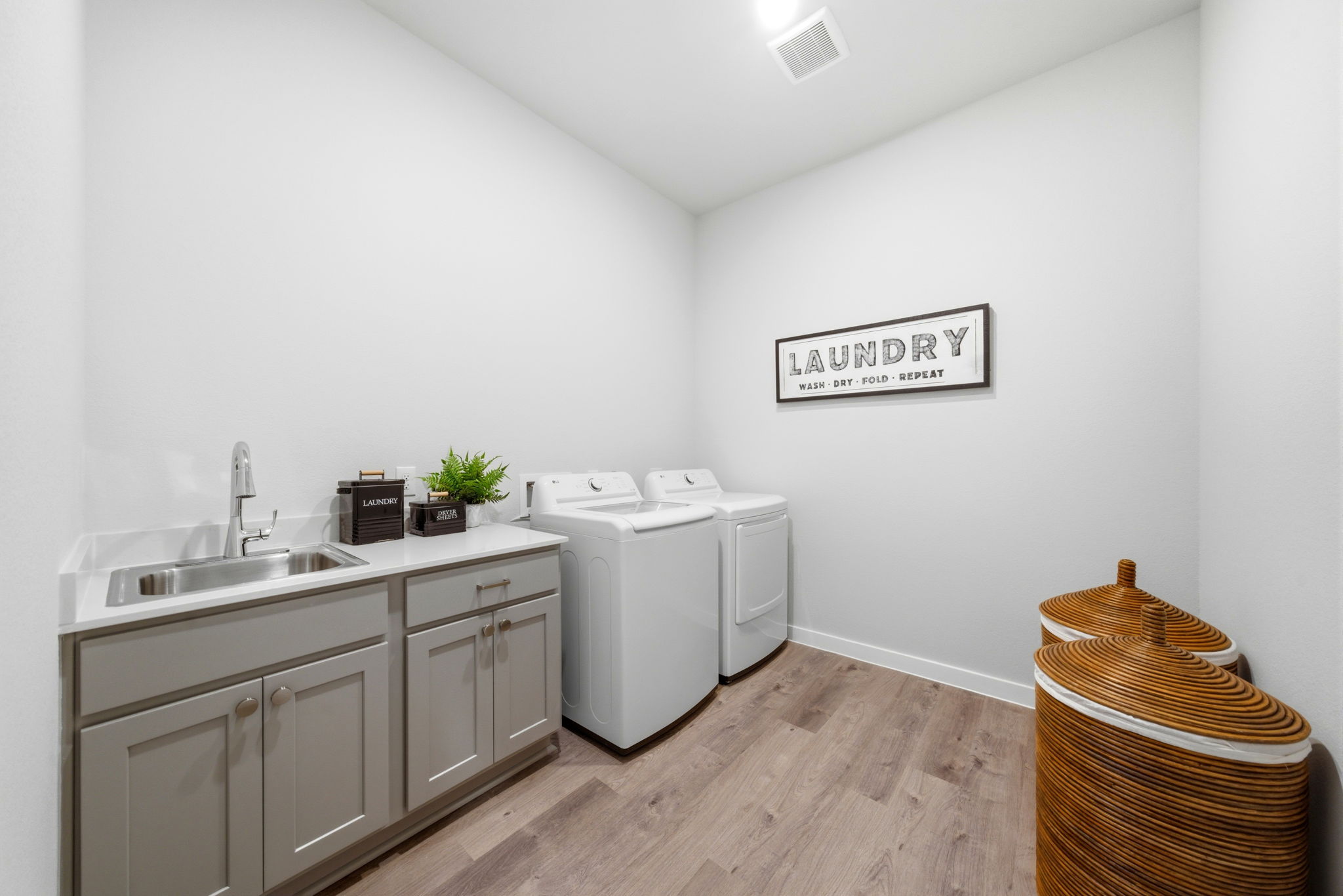 A kitchen with white walls.