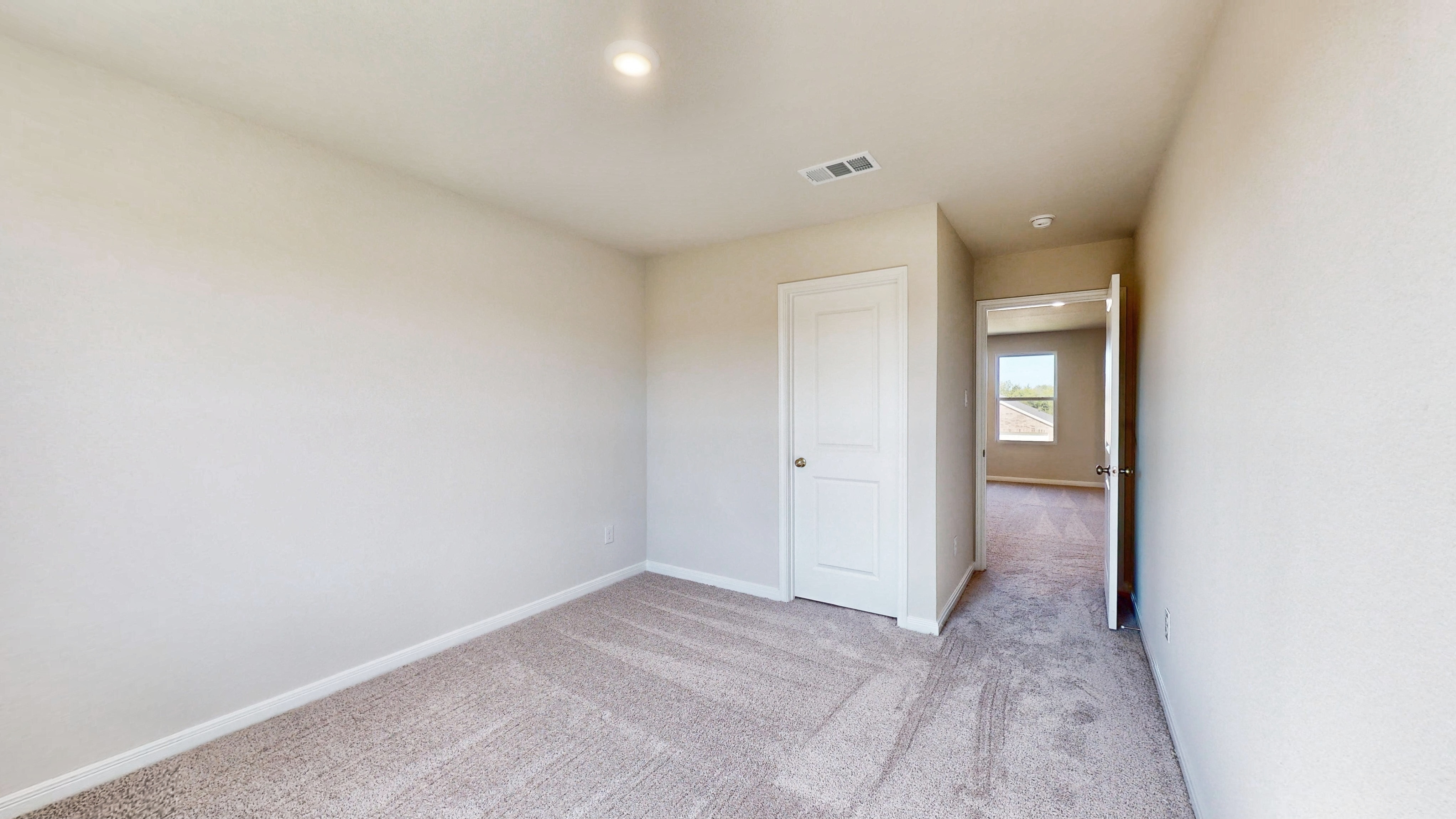 A hallway with white doors.
