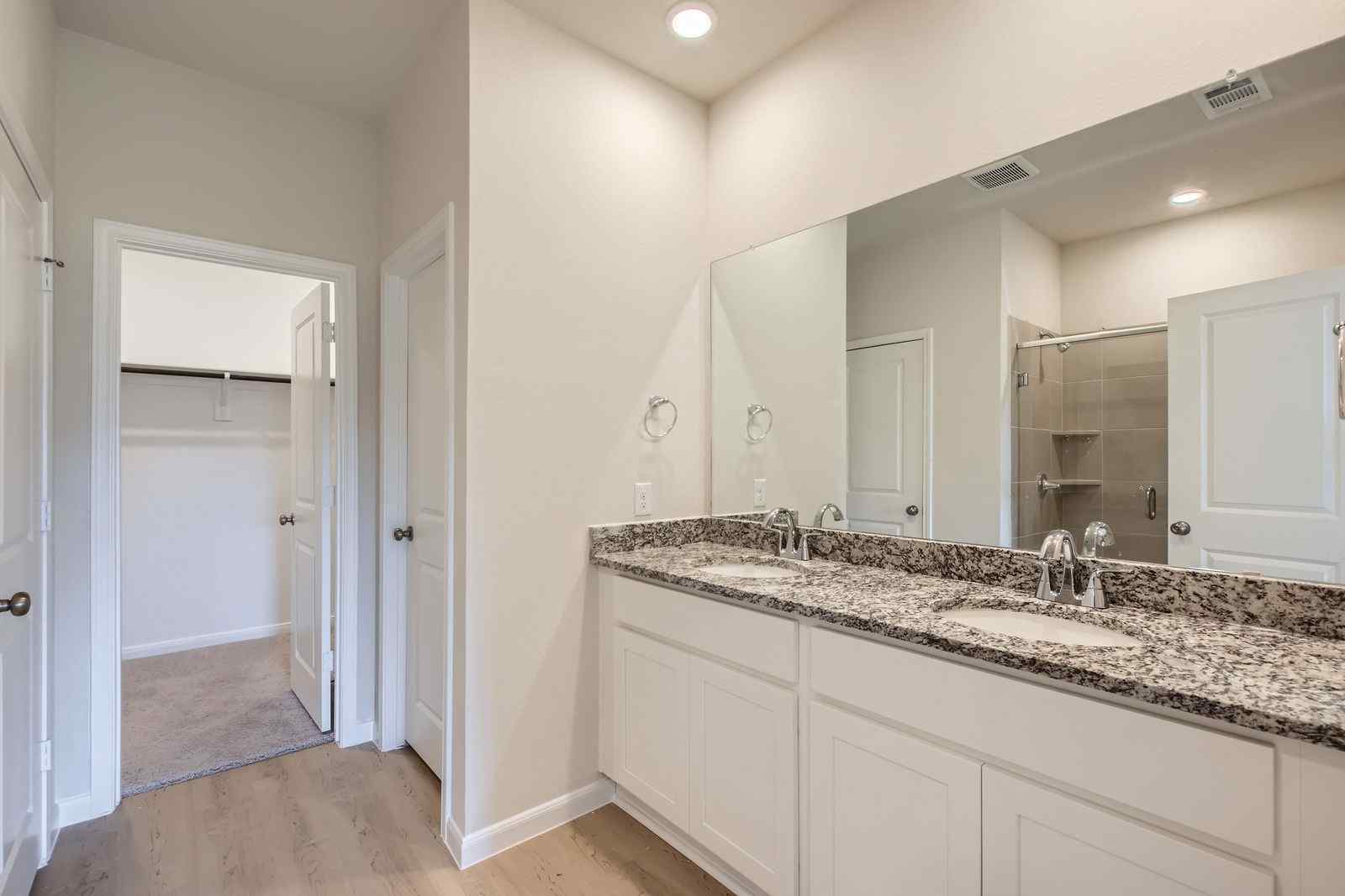A bathroom with a marble countertop.