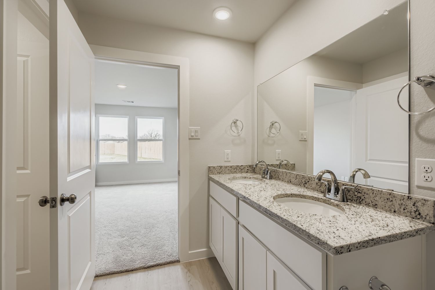 A bathroom with a marble countertop.