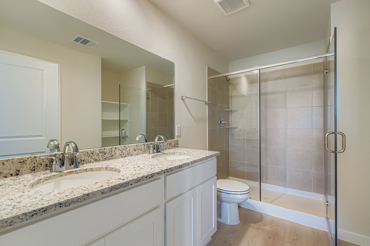 A bathroom with a glass shower.
