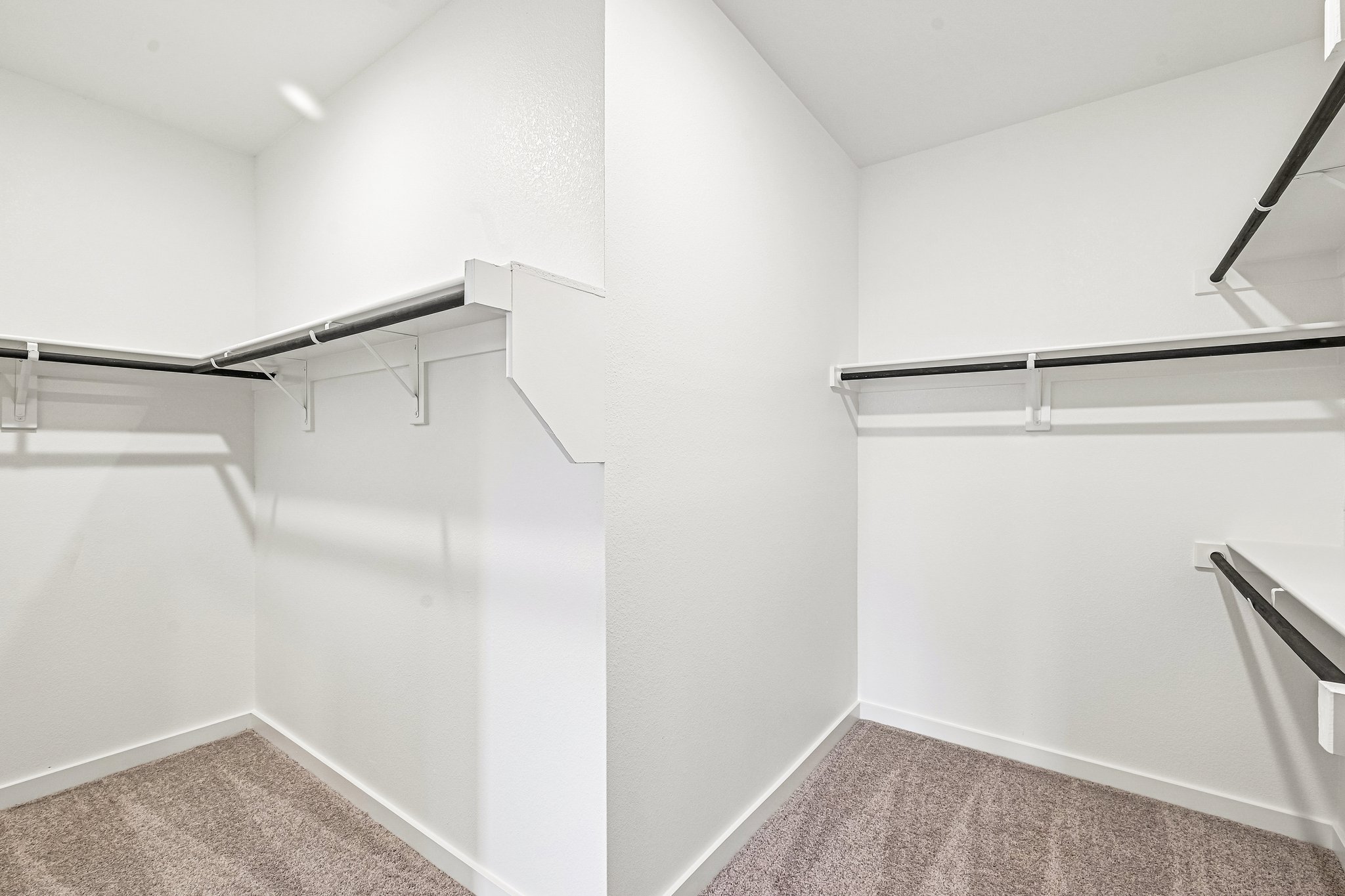 A white room with a staircase.